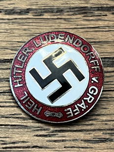 WW2 GERMAN HEIL HITLER LUDENDORFF. V. GRAFE LAPEL PIN: WW2 GERMAN HEIL HITLER LUDENDORFF. V. GRAFE LAPEL PIN WITH THE MAKER MARKS ON THE BACK. A RARE FIND. WAS BROUGHT BACK HOME BY A VET. HAS A GREAT LOOK TO IT WITH AN EXCELLENT OVERALL EYE APPEAL.