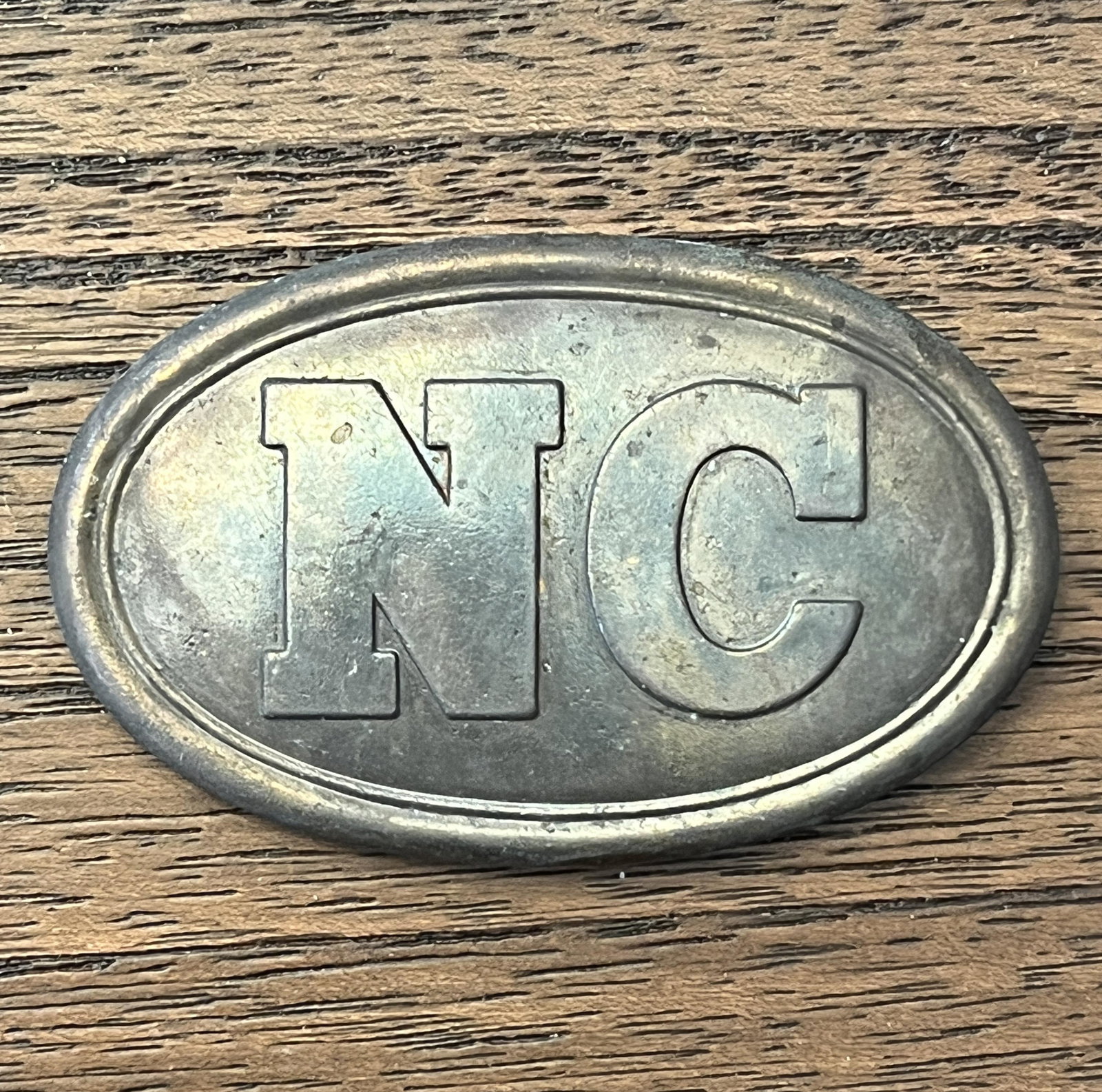 RARE CIVIL WAR NC NORTH CAROLINA BELT BUCKLE: RARE CIVIL WAR NC NORTH CAROLINA BELT BUCKLE. IN MINT OVERALL SHAPE AND CONDITION WITH A BEAUTIFUL OVERALL PATINA. HAS A GREAT LOOK TO IT WITH AN EXCELLENT OVERALL EYE APPEAL. A GREAT FIND AND AN EXCE