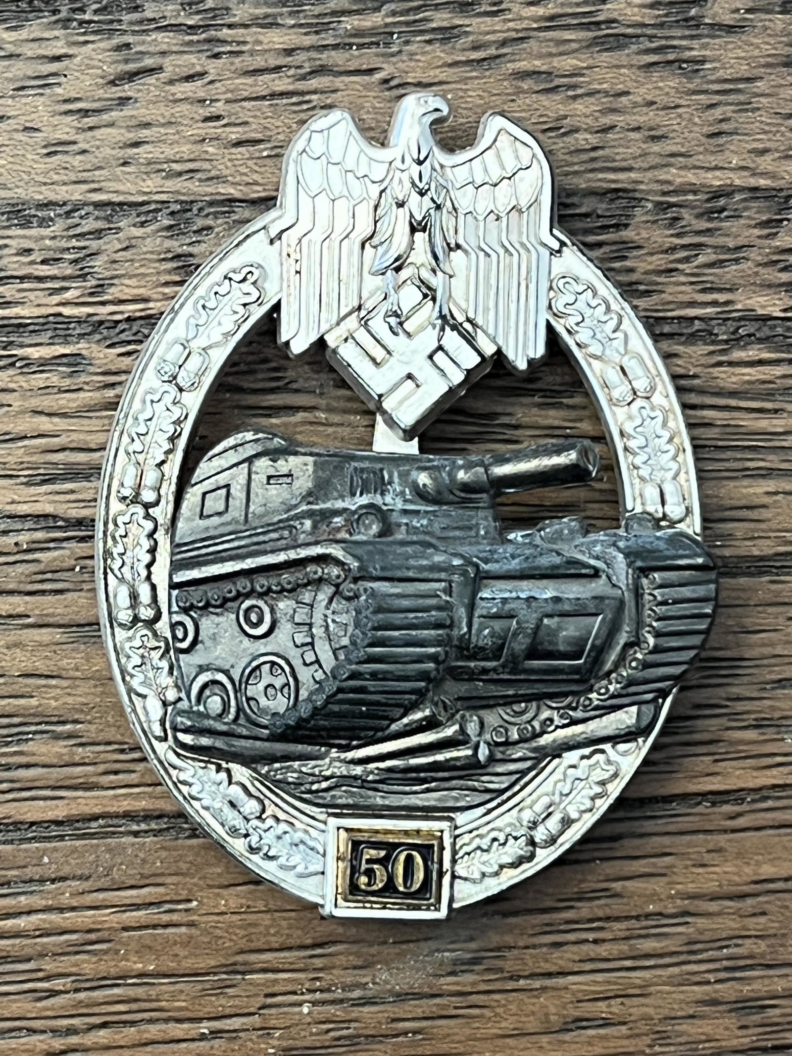 WW2 GERMAN PANZER 50 ENGAGEMENTS TANK BADGE MARKED JFS: WW2 GERMAN PANZER 50 ENGAGEMENTS TANK BADGE MAKER MARKED JFS. A RARE FIND. IT IS IN MINT OVERALL SHAPE AND CONDITION WITH A BEAUTIFUL OVERALL PATINA. HAS A GREAT LOOK TO IT WITH AN EXCELLENT OVERALL P