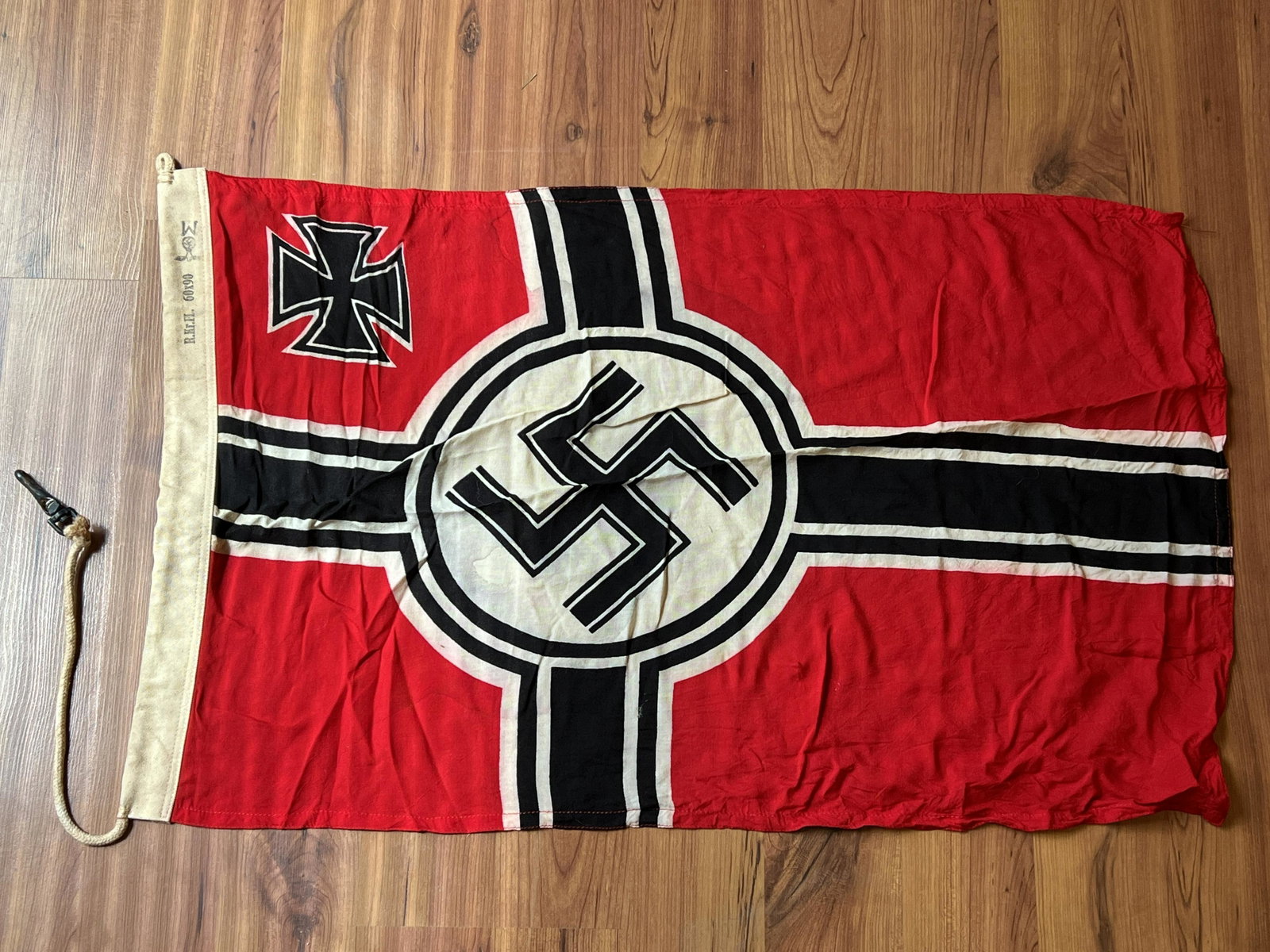 WW2 GERMAN NAZI KREIGSMARINE FLAG MAKER MARKED 60X90: WW2 GERMAN NAZI KREIGSMARINE FLAG MAKER MARKED 60X90. A RARE FIND. IT IS IN MINT OVERALL SHAPE AND CONDITION WITH A BEAUTIFUL OVERALL PATINA. HAS A GREAT LOOK TO IT WITH AN EXCELLENT OVERALL EYE APPEA