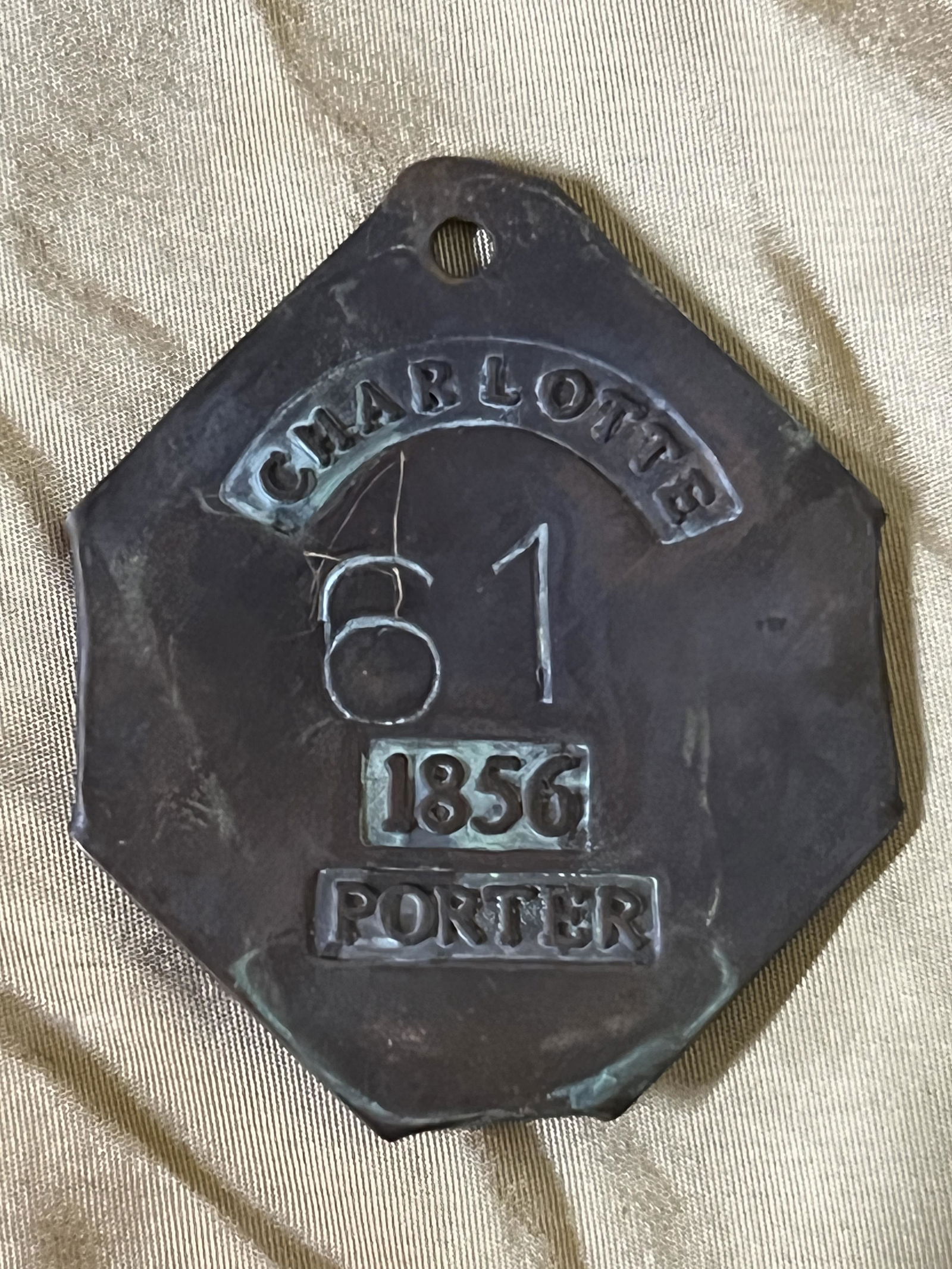 DATED 1857 CHARLOTTE 61 PORTER SLAVE TAG SERVANT ID: DATED 1857 CHARLOTTE 61 PORTER SLAVE TAG SERVANT ID. A RARE FIND. IT IS IN MINT OVERALL SHAPE AND CONDITION WITH A BEAUTIFUL OVERALL PATINA. PLEASE VIEW ALL DETAILED PICTURES. A GREAT FIND AND AN EXCE