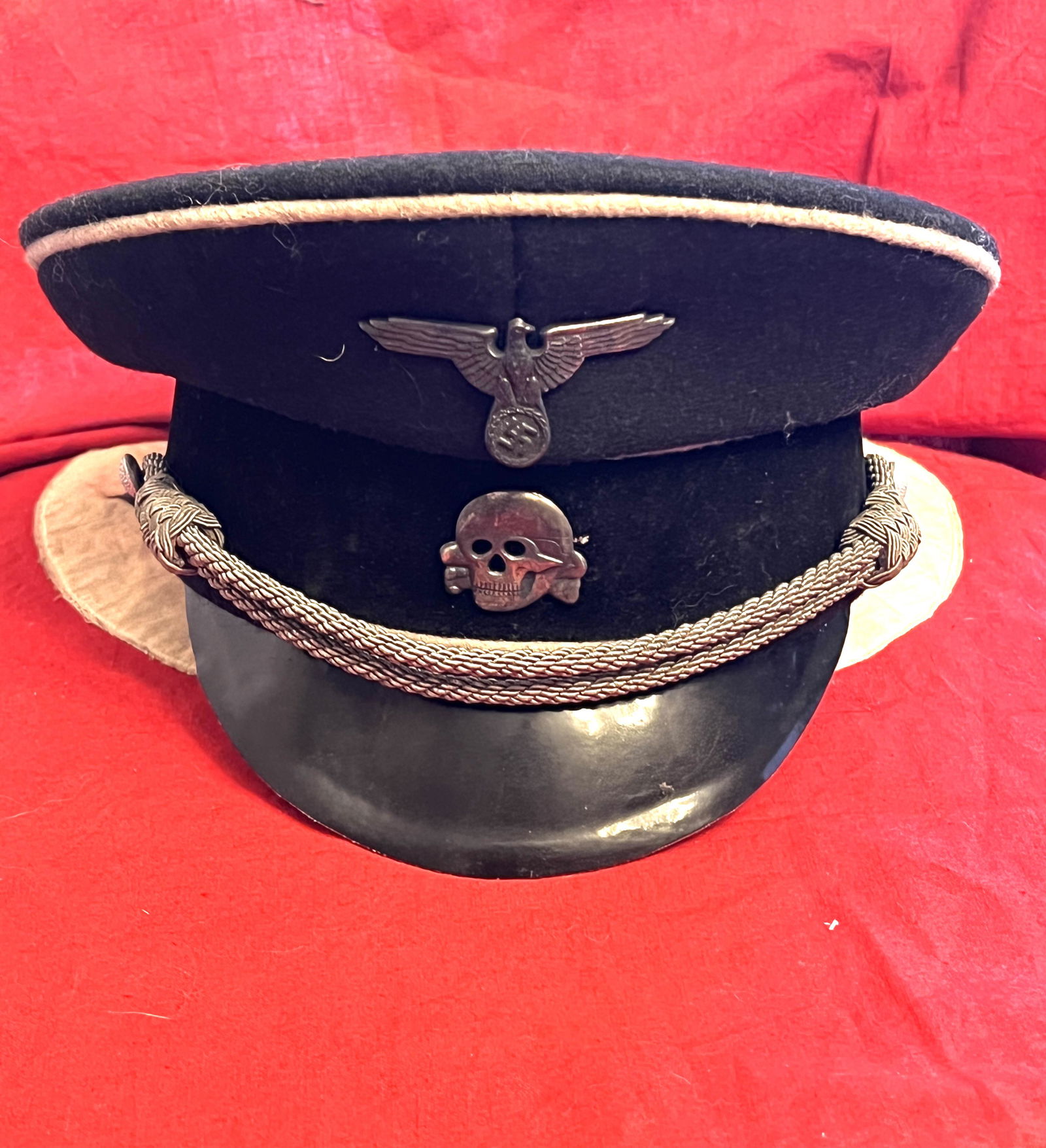 RARE WW2 GERMAN WAFFEN SS TOTENKOPF VISOR CAP W/SS TAG: RARE WW2 GERMAN WAFFEN SS TOTENKOPF VISOR CAP W/SS TAG. A RARE FIND. IT IS IN MINT OVERALL SHAPE AND CONDITION WITH A BEAUTIFUL OVERALL PATINA. HAS A GREAT LOOK TO IT WITH AN EXCELLENT OVERALL EYE APP