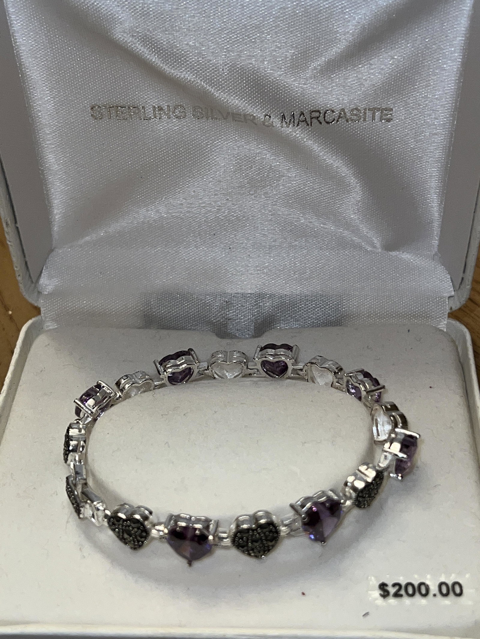 STERLING SILVER AND MARCASITE COCKTAIL BRACELET: STERLING SILVER AND MARCASITE COCKTAIL BRACELET. IN MINT OVERALL SHAPE AND CONDITION. A GREAT FIND AND AN EXCELLENT ADDITION TO YOUR COLLECTION.