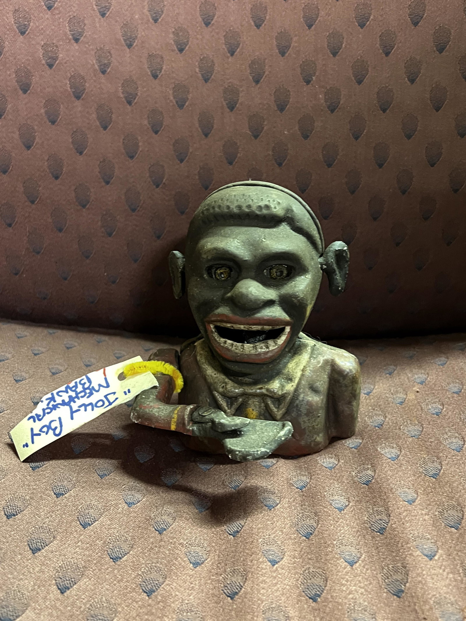 ANTIQUE BLACK AMERICANA JOLLY BOY MECHANICAL BANK: ANTIQUE BLACK AMERICANA JOLLY BOY MECHANICAL BANK. A RARE FIND. SHOWS HEAVY WEAR AND TEAR. PLEASE VIEW ALL DETAILED PICTURES. A GREAT ADDITION TO YOUR HISTORY COLLECTION.