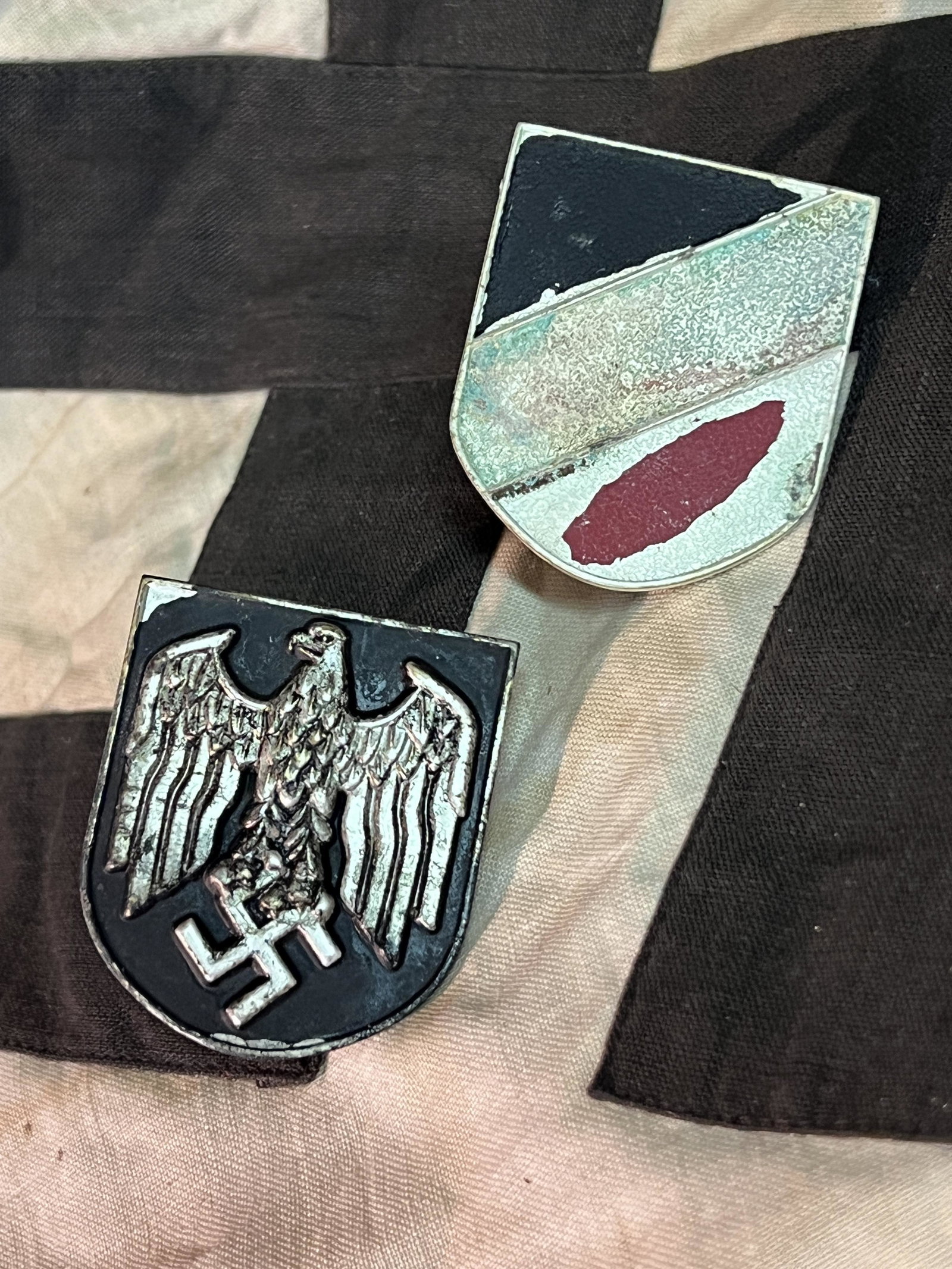 WW2 GERMAN AFRIKA KORPS PITH HELMET SHIELD INSIGNIA'S PAIR: WW2 GERMAN AFRIKA KORPS PITH HELMET SHIELD INSIGNIA'S PAIR. ONE OF THE SHIELD IS MAKER MARKED ON THE BACK. PLEASE VIEW ALL DETAILED PICTURES. HAS A GREAT LOOK TO IT WITH AN EXCELLENT OVERALL EYE APPEA