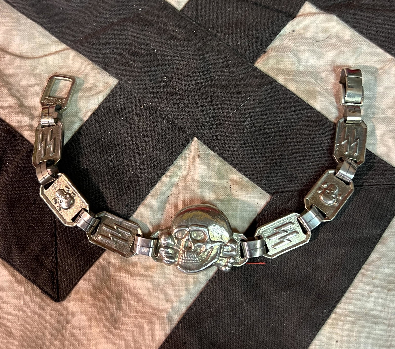 WW2 GERMAN TOTENKOPF SS SKULL OFFICER BRACELET - FROM GERMANY MARKED SDTW BERLIN: WW2 GERMAN TOTENKOPF SS SKULL OFFICER BRACELET - FROM GERMANY. MAKER MARKED SDTW BERLIN. WAS PURCHASED DECADES AGO IN GERMANY AND WAS BROUGHT BACK HOME. HAS A GREAT LOOK TO IT WITH AN EXCELLENT OVERAL