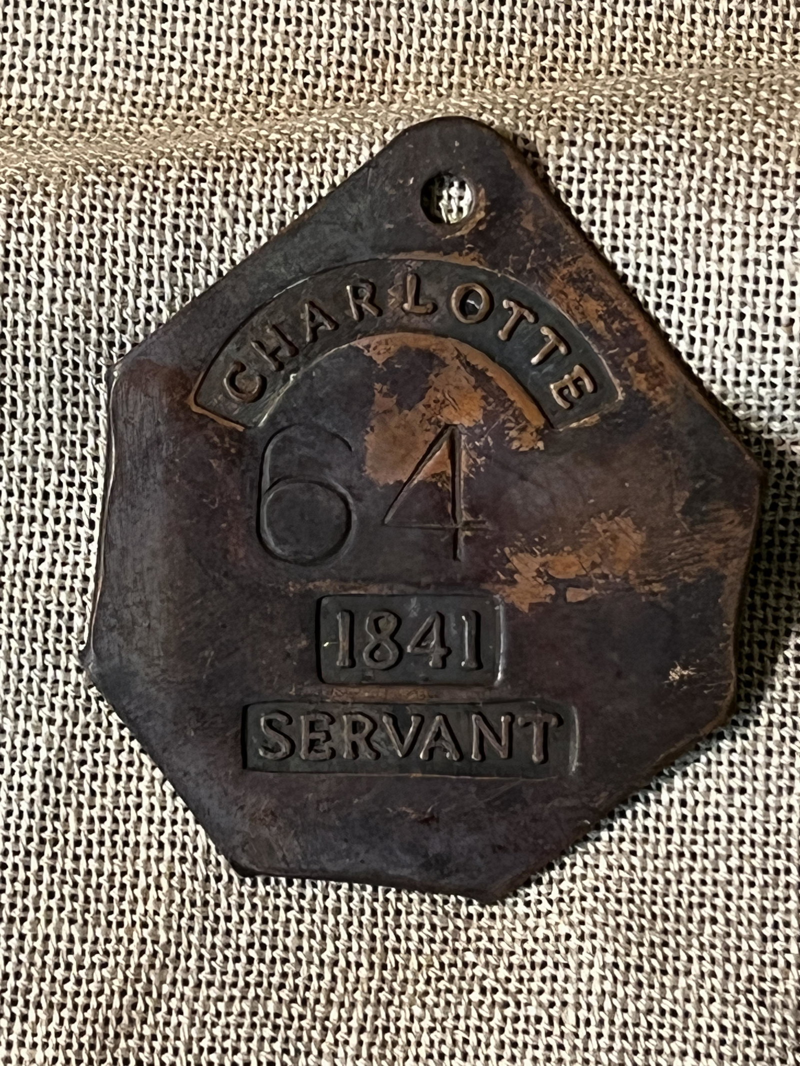 1841 CHARLOTTE, SOUTH CAROLINA SERVANT SLAVE TAG #64: 1841 CHARLOTTE, SOUTH CAROLINA SERVANT SLAVE TAG #64. A RARE FIND. IT IS IN MINT OVERALL SHAPE AND CONDITION WITH A BEAUTIFUL OVERALL PATINA. HAS A GREAT LOOK TO IT WITH AN EXCELLENT OVERALL EYE APPEA