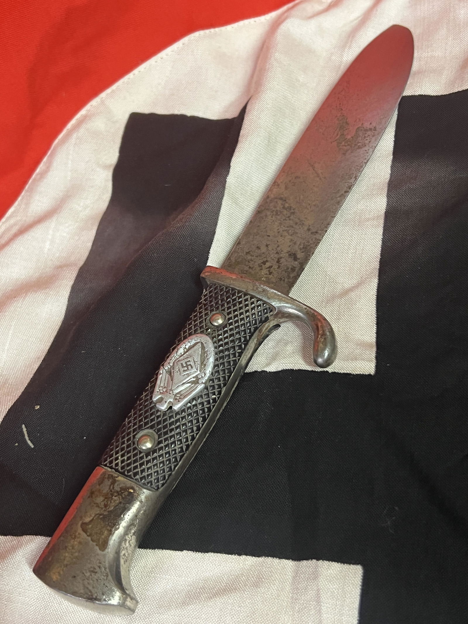 RARE WW2 GERMAN NAZI HITLER YOUTH DAGGER: RARE WW2 GERMAN NAZI HITLER YOUTH DAGGER. RARE DAGGER WITH A RARE INSIGNIA ATTACHED TO IT. HAS A GREAT LOOK TO IT WITH AN EXCELLENT OVERALL EYE APPEAL. DAGGER APPEARS TO BE VERY WELL USED DURING BATTL
