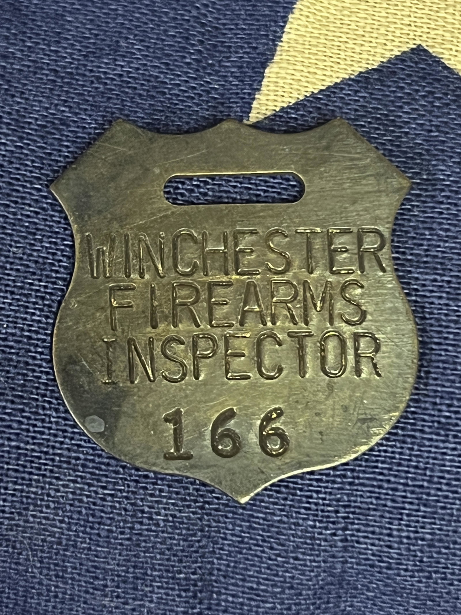ANTIQUE CIVIL WAR WINCHESTER FIREARMS INSPCTOR #166 TAG: ANTIQUE CIVIL WAR WINCHESTER FIREARMS INSPCTOR #166 TAG. A RARE FIND. IT IS IN MINT OVERALL SHAPE AND CONDITION WITH A BEAUTIFUL OVERALL PATINA. HAS A GREAT LOOK TO IT WITH AN EXCELLENT OVERALL EYE AP
