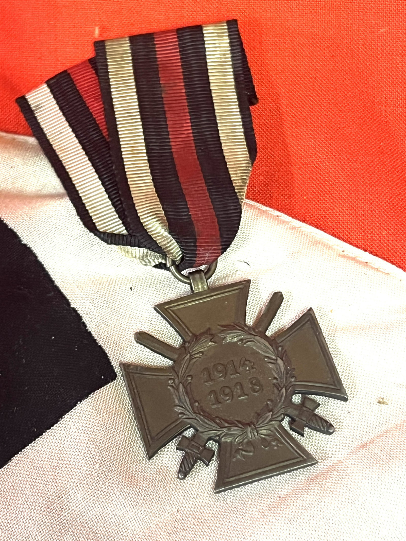 WW1 GERMAN VETERANS MERIT CROSS W/SWORDS AND RIBBON: WW1 GERMAN VETERANS MERIT CROSS W/SWORDS AND RIBBON. A RARE FIND. IT IS IN MINT OVERALL SHAPE AND CONDITION WITH A BEAUTIFUL OVERALL PATINA. A GREAT FIND AND AN EXCELLENT ADDITION TO YOUR COLLECTION.