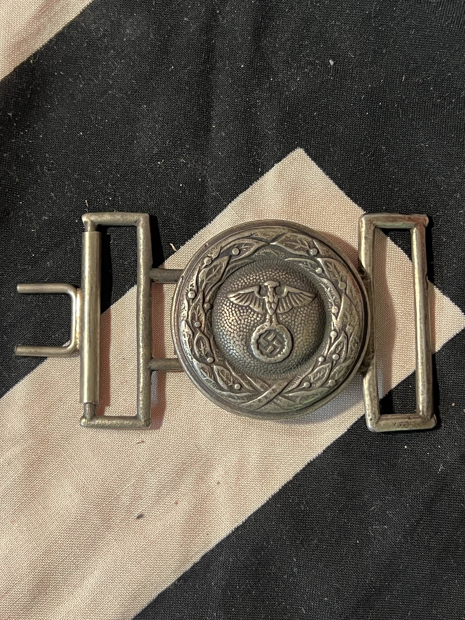 WW2 GERMAN SA 2-PIECE BELT BUCKLE MARKED RZM M34/2: WW2 GERMAN SA 2-PIECE BELT BUCKLE MARKED RZM M34/2. A RARE FIND. IT IS WELL MARKED ON THE BACK WITH THE MAKER MARKS. SHOWS A LOT OF USE, WEAR, AND A BEAUTIFUL PATINA THROUGHOUT. PLEASE VIEW ALL DETAIL