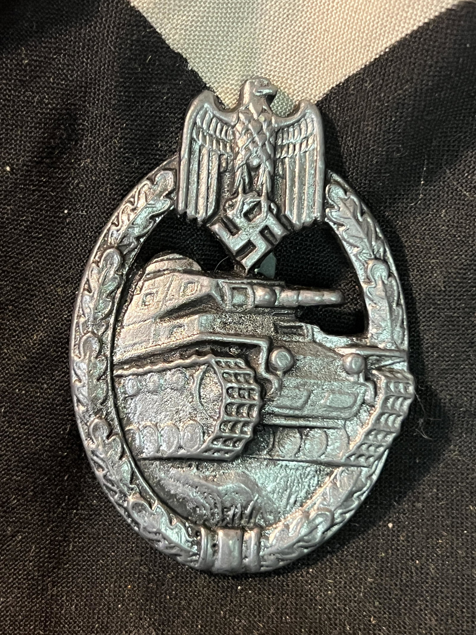 WW2 GERMAN PANZER TANK BADGE IN SILVER: WW2 GERMAN PANZER TANK BADGE IN SILVER. IT IS IN MINT OVERALL SHAPE AND CONDITION WITH A NICE PATINA THROUGHOUT. PLEASE VIEW ALL DETAILED PICTURES. A WELL MADE ANTIQUE GERMAN ARTIFACT.