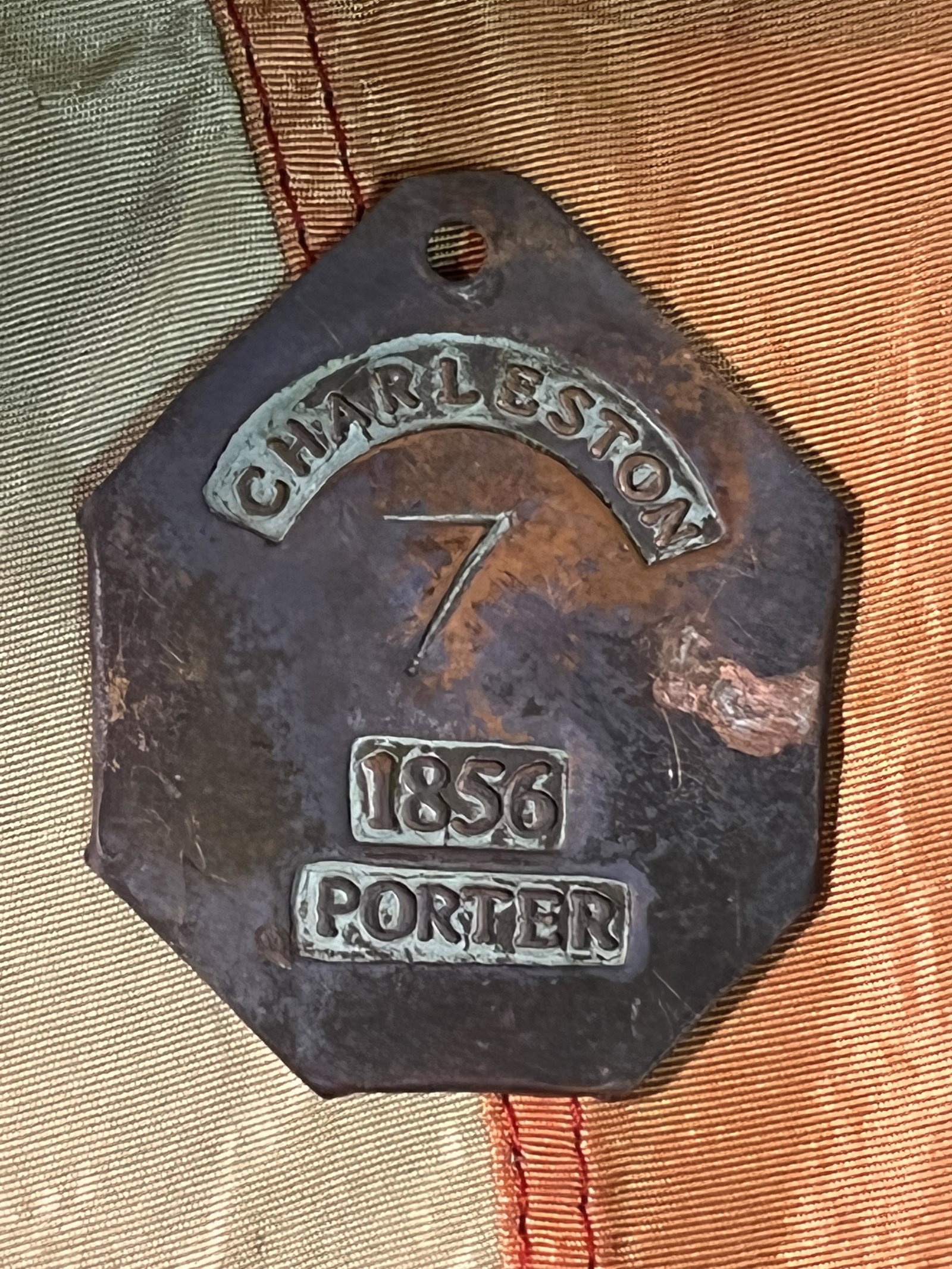 DATED 1856 CHARLESTON, S.C. PORTER SERVANT SLAVE TAG: DATED 1856 CHARLESTON, S.C. PORTER SERVANT SLAVE TAG. A RARE FIND. IT IS IN GOOD OVRALL SHAPE AND CONDITION WITH A NICE PATINA THROUGHOUT. HIGHLY COLLECTIBLE AND SOUTH AFTER ITEM. PLEASE VIEW ALL DETA