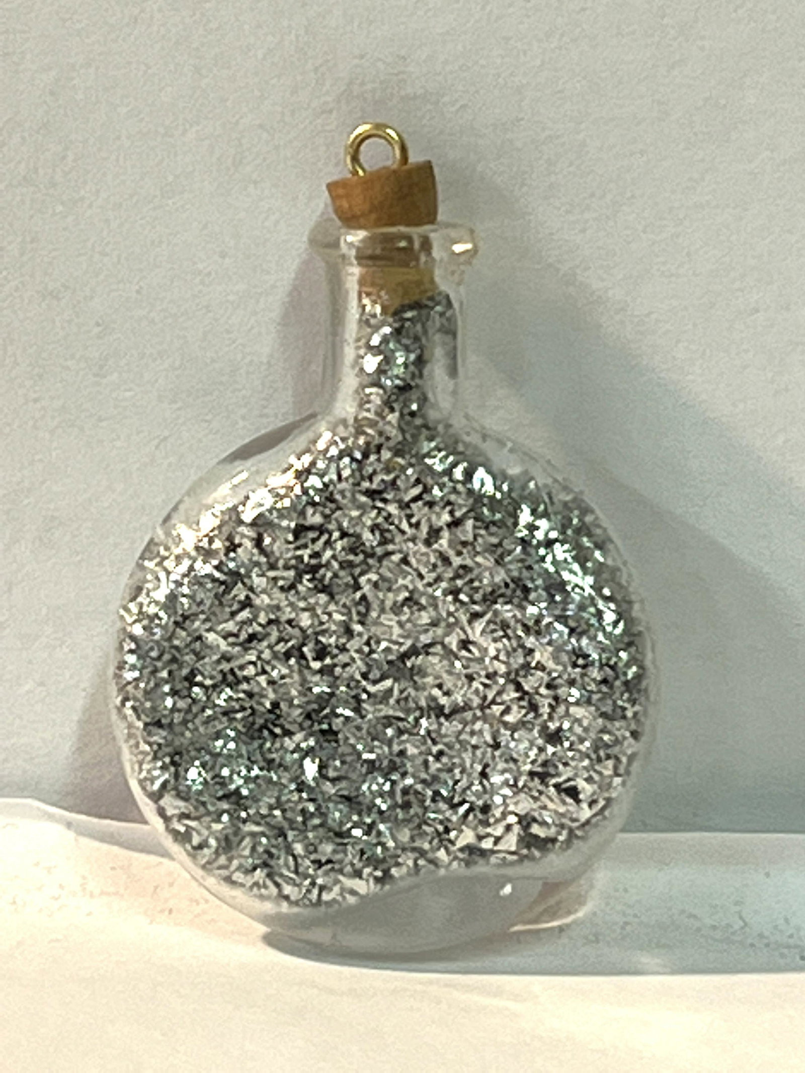 .9999 PURE SILVER BOTTLED CHIPS PENDANT: .9999 PURE SILVER BOTTLED CHIPS PENDANT. A GREAT ADDITION TO YOUR COLLECTION.
