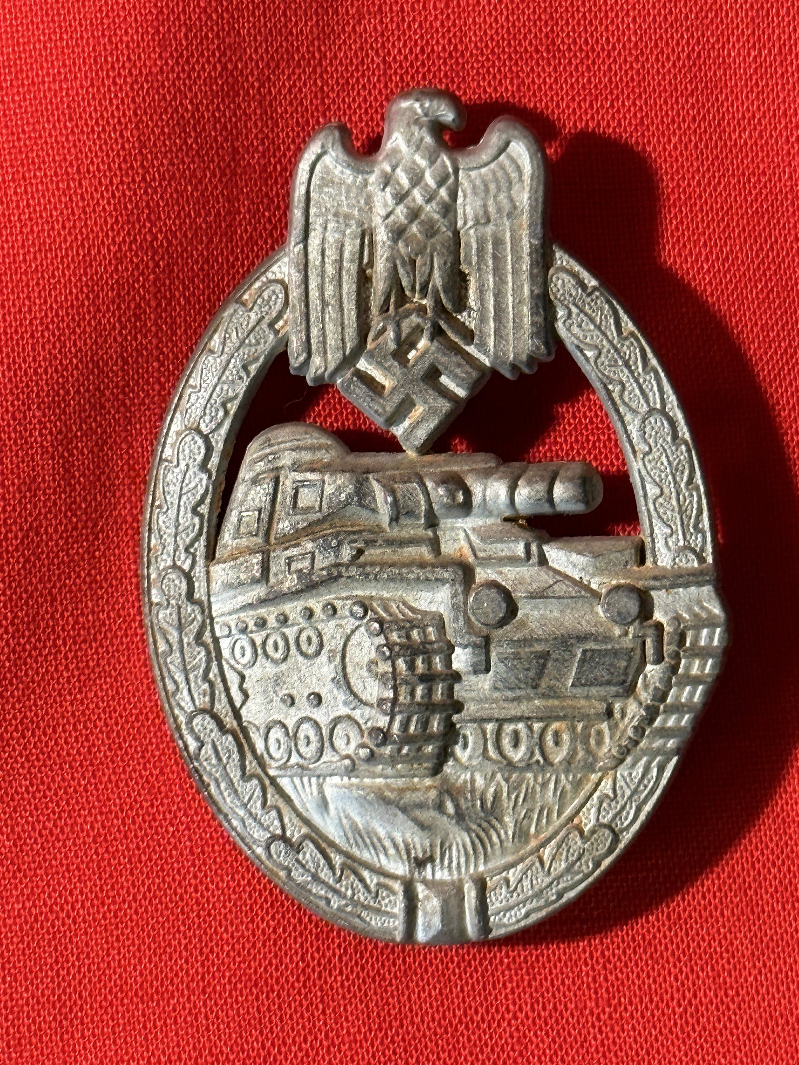 WW2 GERMAN PANZER TANK BADGE - MAKER MARKED: WW2 GERMAN PANZER TANK BADGE - MAKER MARKED. A RARE FIND. IT IS IN GOOD SHAPE AND OVERALL CONDITION WITH A NICE PATINA THROUGHOUT. PLEASE VIEW ALL DETAILED PICTURES. A WELL MADE ANTIQUE GERMAN ARTIFAC