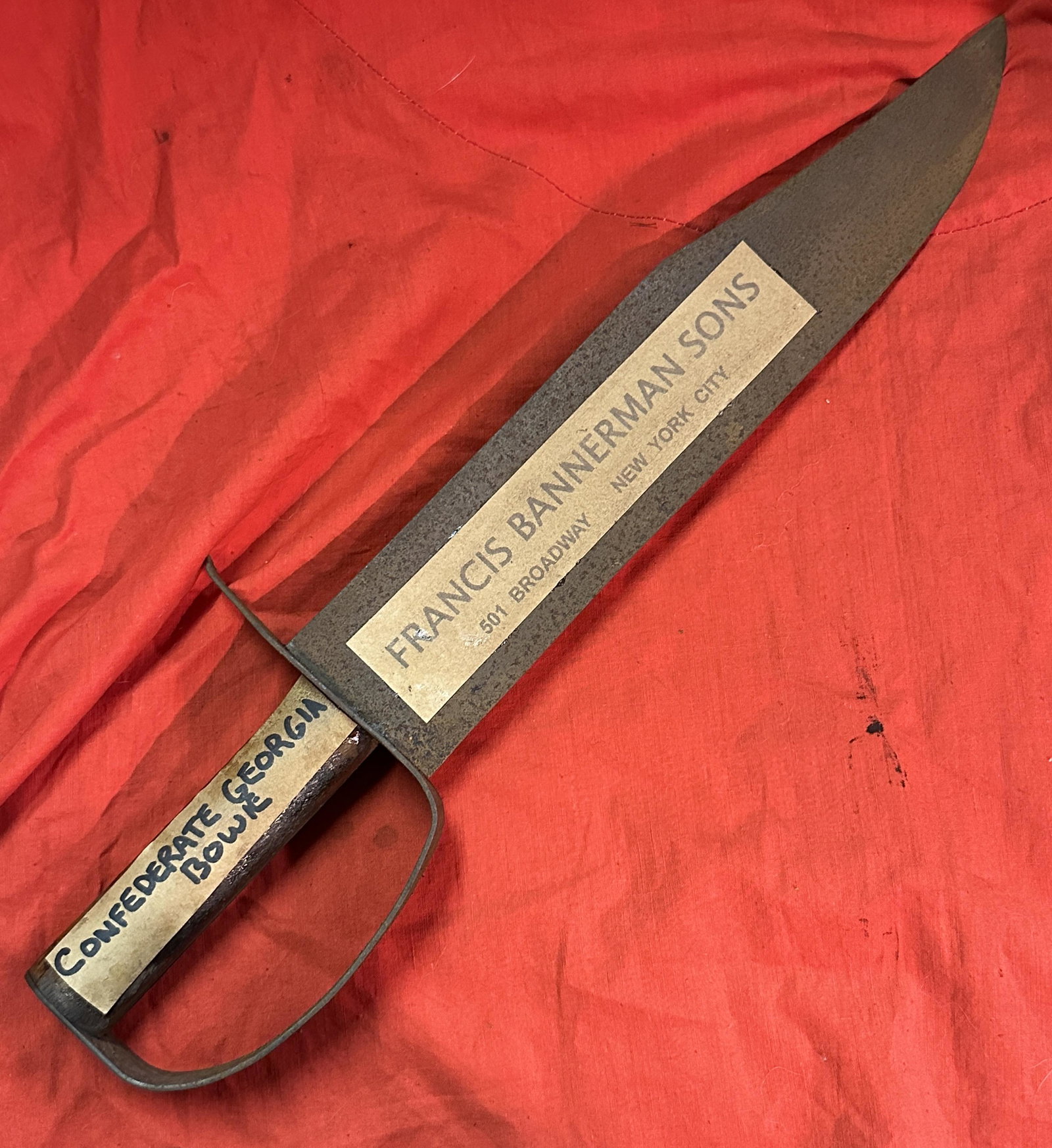 BANNERMAN'S CONFEDERATE CIVIL WAR GEORGIA BOWIE KNIFE: BANNERMAN'S CONFEDERATE CIVIL WAR GEORGIA CLIP POINT D-GUARD BOWIE KNIFE. A VERY RARE FIND. STILL HAS THE ORIGINAL STORE STICKERS ON IT. HAS A GREAT LOOK TO IT WITH AN EXCELLENT OVERALL EYE APPEAL. A 