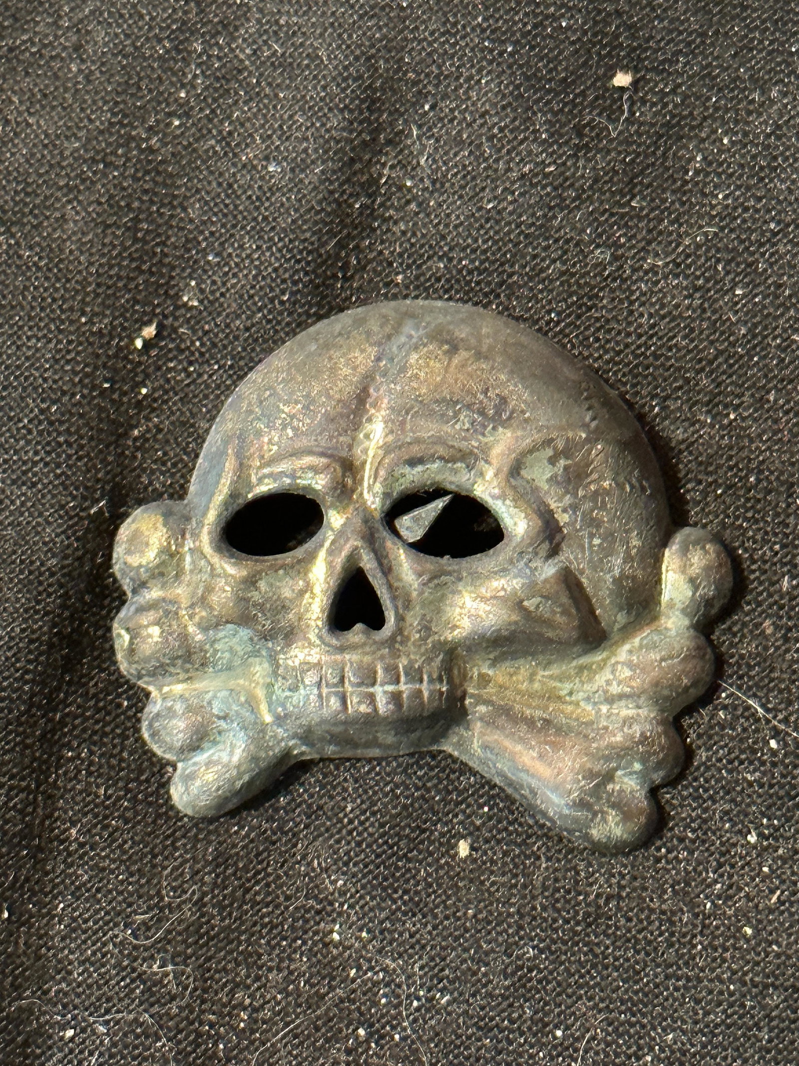 EARLY WW2 GERMAN TOTENKOPF SS SKULL CAP INSIGNIA: EARLY WW2 GERMAN TOTENKOPF SS SKULL CAP INSIGNIA. A RARE FIND. MAKER MARKED WITH RZM, ETC. IT IS IN MINT OVERALL SHAPE AND CONDITION WITH A NICE PATINA THROUGHOUT. PLEASE VIEW ALL DETAILED PICTURES. A