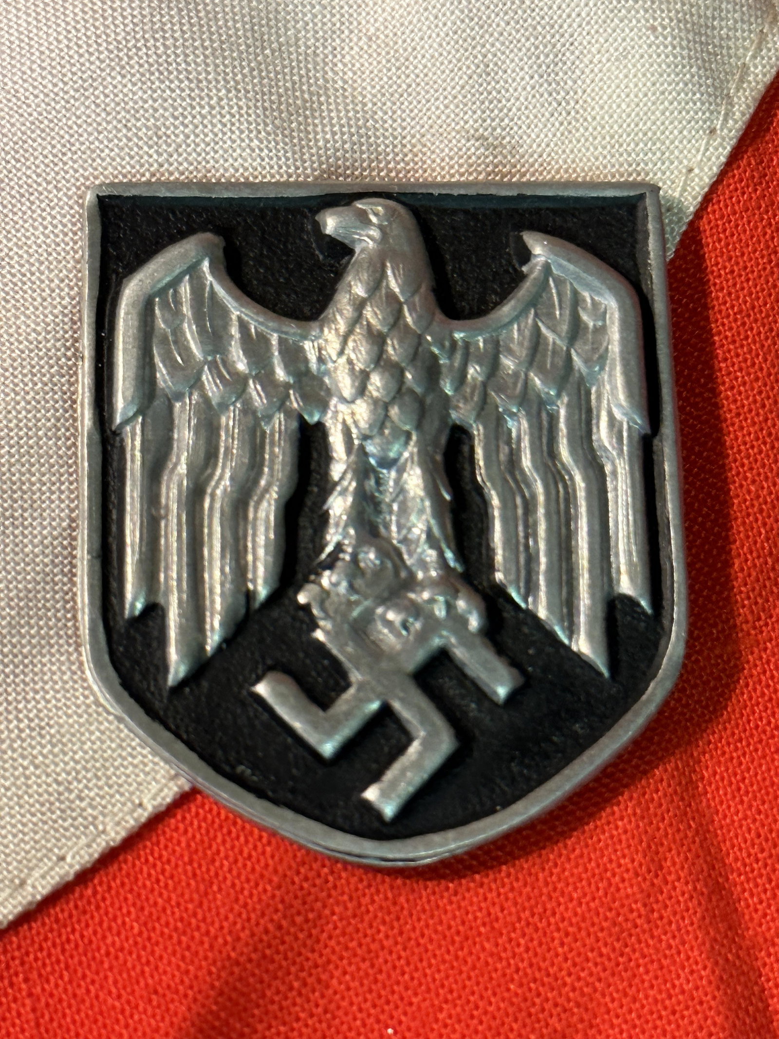 WW2 GERMAN WEHRMACHT HELMET SHIELD: WW2 GERMAN WEHRMACHT HELMET SHIELD. IT IS IN MINT OVERALL SHAPE AND CONDITION WITH A BEAUTIFUL OVERALL PATINA. A WELL MADE ANTIQUE GERMAN ARTIFACT.