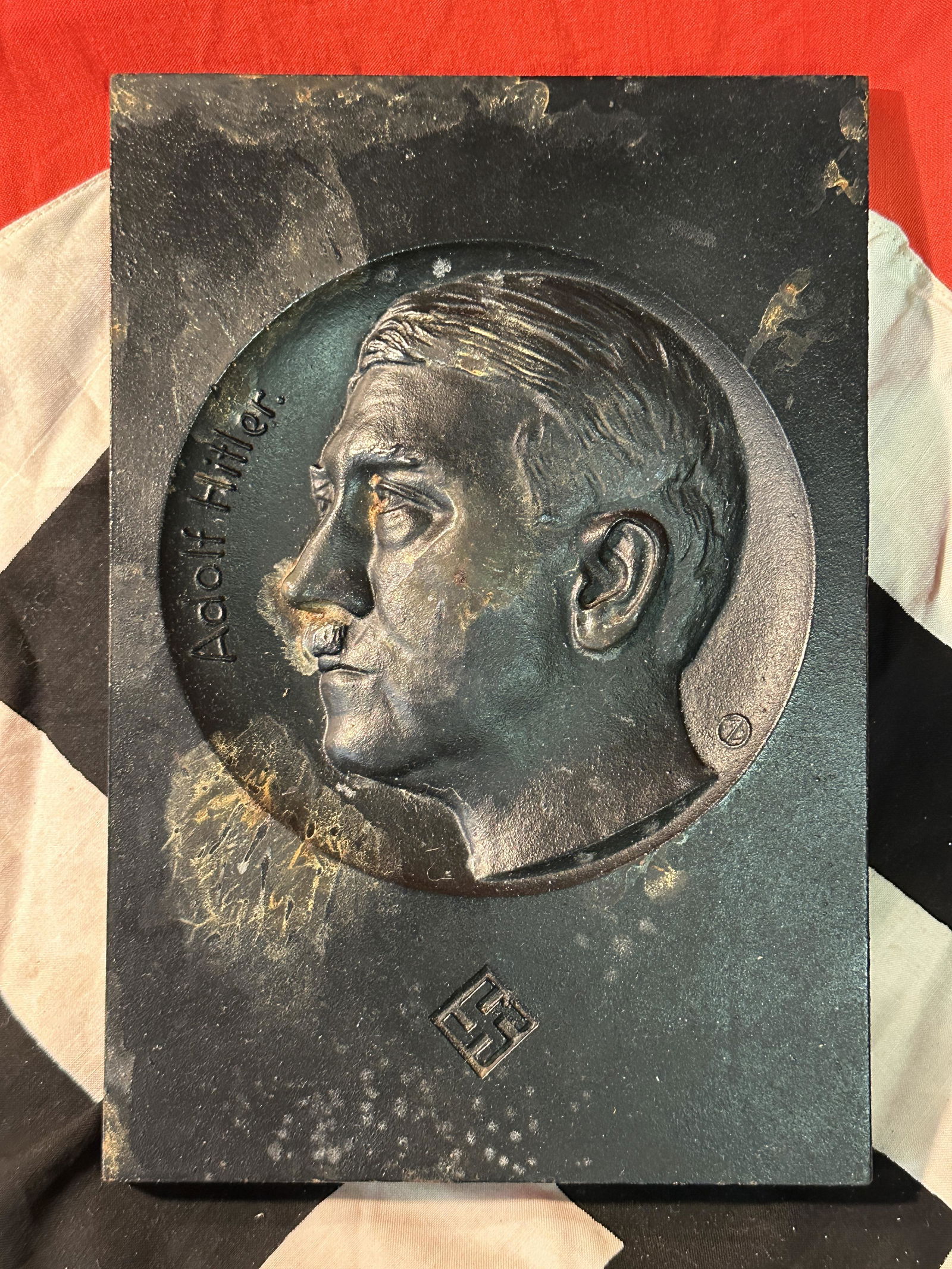 WW2 GERMAN ADOLF HITLER BUILDING WALL PLAQUE: WW2 GERMAN ADOLF HITLER BUILDING WALL PLAQUE. A RARE FIND. WAS BROUGHT BACK HOME BY A VET. IT IS IN GOOD SHAPE AND CONDITION WITH A NICE PATINA THROUGHOUT. A WELL MADE ANTIQUE GERMAN ARTIFACT.