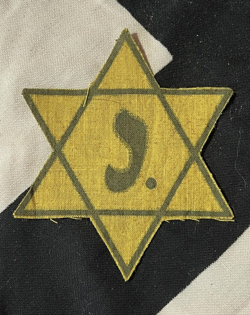 WW2 GERMAN JEWISH BELGIAN STAR OF DAVID FROM CONCENTRATION CAMP: WW2 GERMAN JEWISH BELGIAN STAR OF DAVID FROM CONCENTRATION CAMP. WAS BROUGHT BACK HOME BY A VET. DARK YELLOW WITH BLACK OUTLINE, "J" IN CENTER. A RARE HISTORIC ITEM. PLEASE VIEW ALL DETAILED PICTURES.