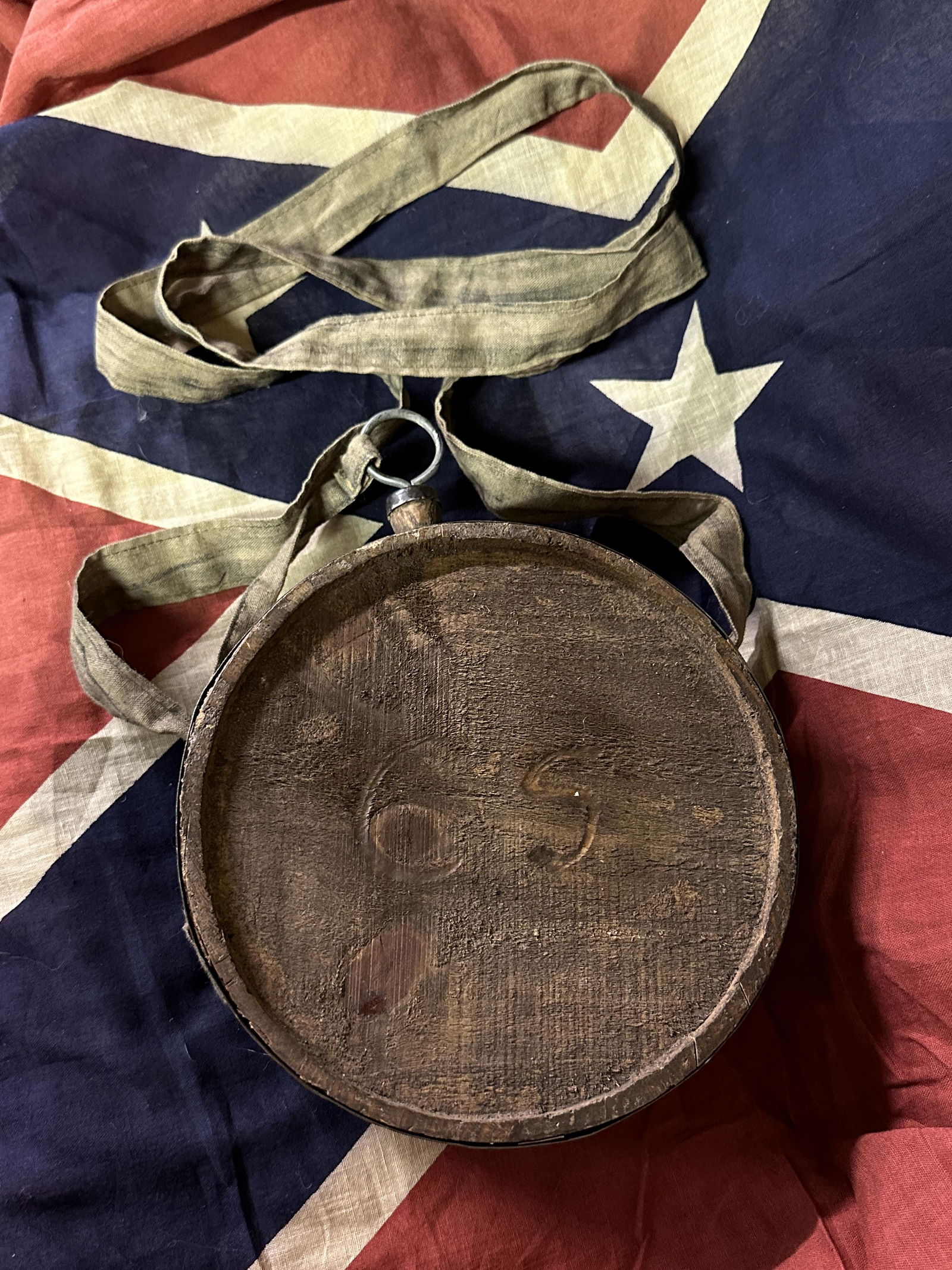 SCARCE CIVIL WAR CONFEDERATE C.S. WOODEN CANTEEN WITH CANVAS SLING: SCARCE CIVIL WAR CONFEDERATE C.S. WOODEN CANTEEN WITH CANVAS SLING. A VERY RARE FIND. HAS THE C.S. ENGRAVED ON THE FRONT OF THE CANTEEN. SHOWS GOOD WEAR AND USE. HAS A GREAT LOOK TO IT WITH AN EXCELLE