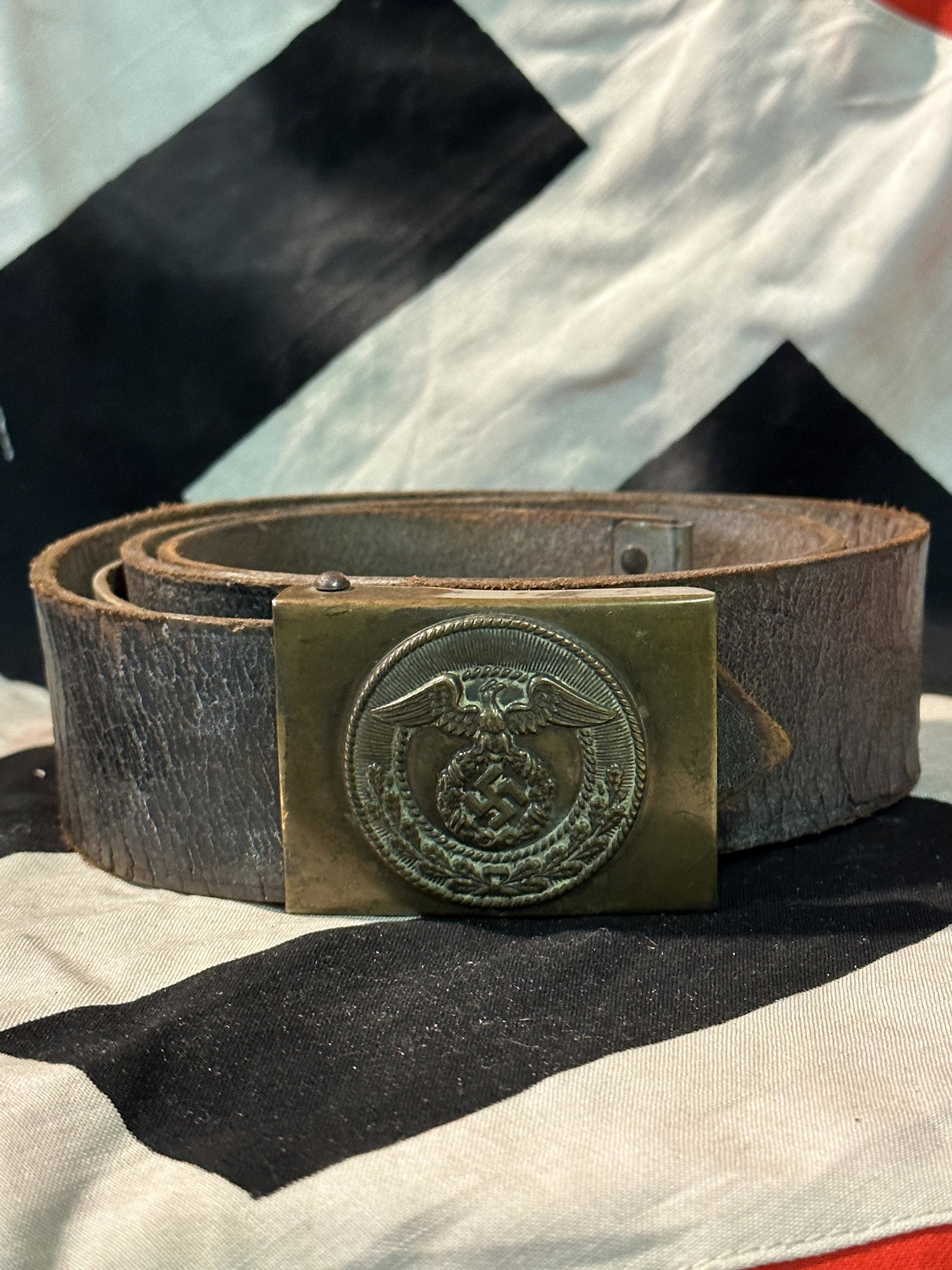 WW2 GERMAN SA STURMABTEILUNG BROWN LEATHER BELT AND BUCKLE: WW2 GERMAN SA STURMABTEILUNG BROWN LEATHER BELT AND BUCKLE. A RARE FIND. IT IS IN MINT OVERALL SHAPE AND CONDITION WITH A BEAUTIFUL OVERALL PATINA. SHOWS GOOD WEAR AND USE. PLEASE VIEW ALL DETAILED PI