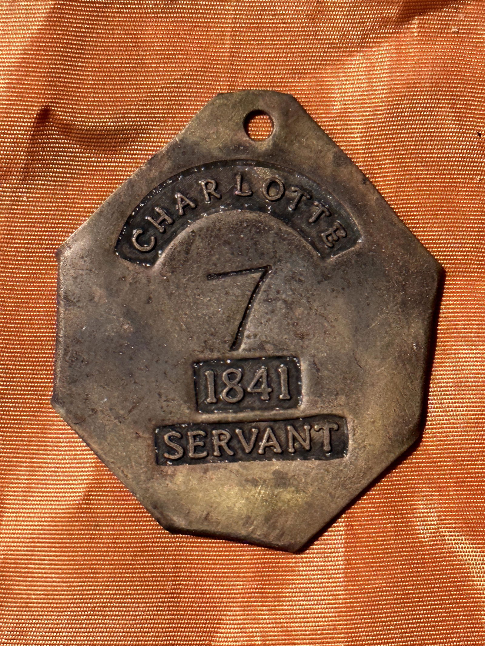 DATED 1841 CHARLOTTE SERVANT #7 SLAVE SERVANT TAG: DATED 1841 CHARLOTTE SERVANT #7 SLAVE SERVANT TAG. A VERY RARE FIND. IN MINT SHAPE AND CONDITION WITH A BEAUTIFUL OVERALL PATINA THROUGHOUT. SHOWS GOOD USE AND WEAR. PLEASE VIEW ALL DETAILED PICTURES.