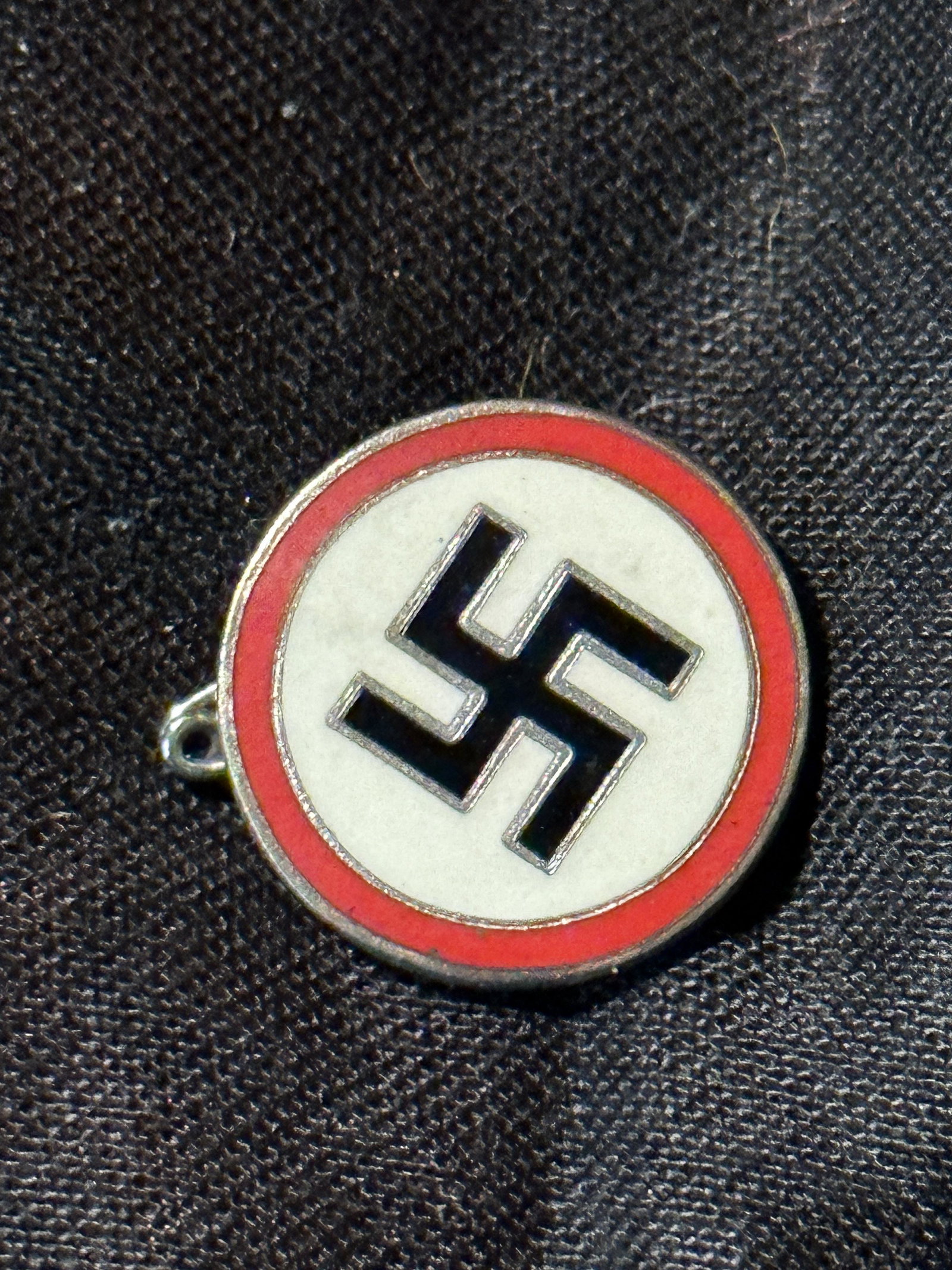 WW2 GERMAN SWASTIKA ENAMELED LAPEL PIN MARKED RZM 41: WW2 GERMAN SWASTIKA ENAMELED LAPEL PIN MARKED RZM 41. A RARE FIND. IT IS IN MINT OVERALL SHAPE AND CONDITION WITH A BEAUTIFUL OVERALL PATINA. PLEASE VIEW ALL DETAILED PICTURES. A WELL MADE ANTIQUE GER