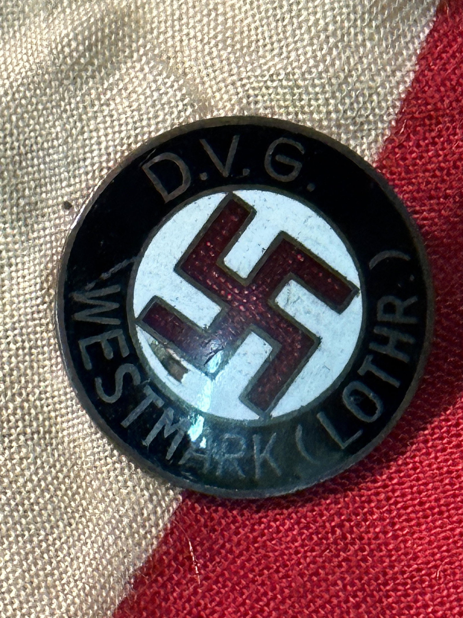 WW2 GERMAN DVG WESTMARK (LOTHR) LAPEL ENAMELED PIN BY W. REDO SAARLAUTERN: WW2 GERMAN DVG WESTMARK (LOTHR) LAPEL ENAMELED PIN BY W. REDO SAARLAUTERN. A RARE FIND. IT IS IN MINT OVERALL SHAPE AND CONDITION WITH A BEAUTIFUL OVERALL PATINA. WAS BROUGHT BACK HOME BY A VET. SHOWS
