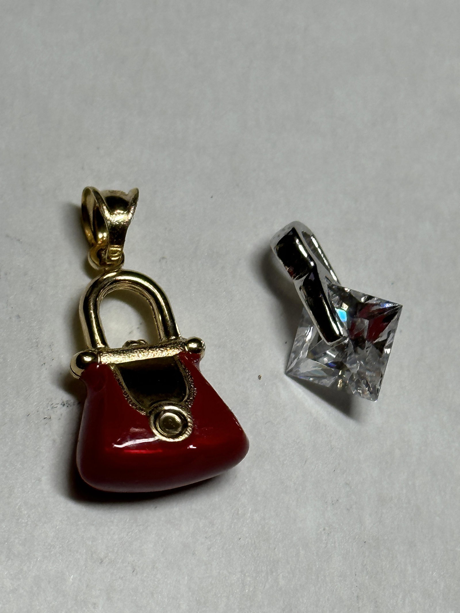 ESTATE LOT OF (2) 14K GOLD LADIES PENDANTS: ESTATE LOT OF (2) 14K GOLD LADIES PENDANTS. SOLD AS A LOT - ALL FOR ONE MONEY. THEY BOTH ARE MARKED 14K. A GREAT FIND AND AN EXCELLENT ADDITION TO YOUR COLLECTION.