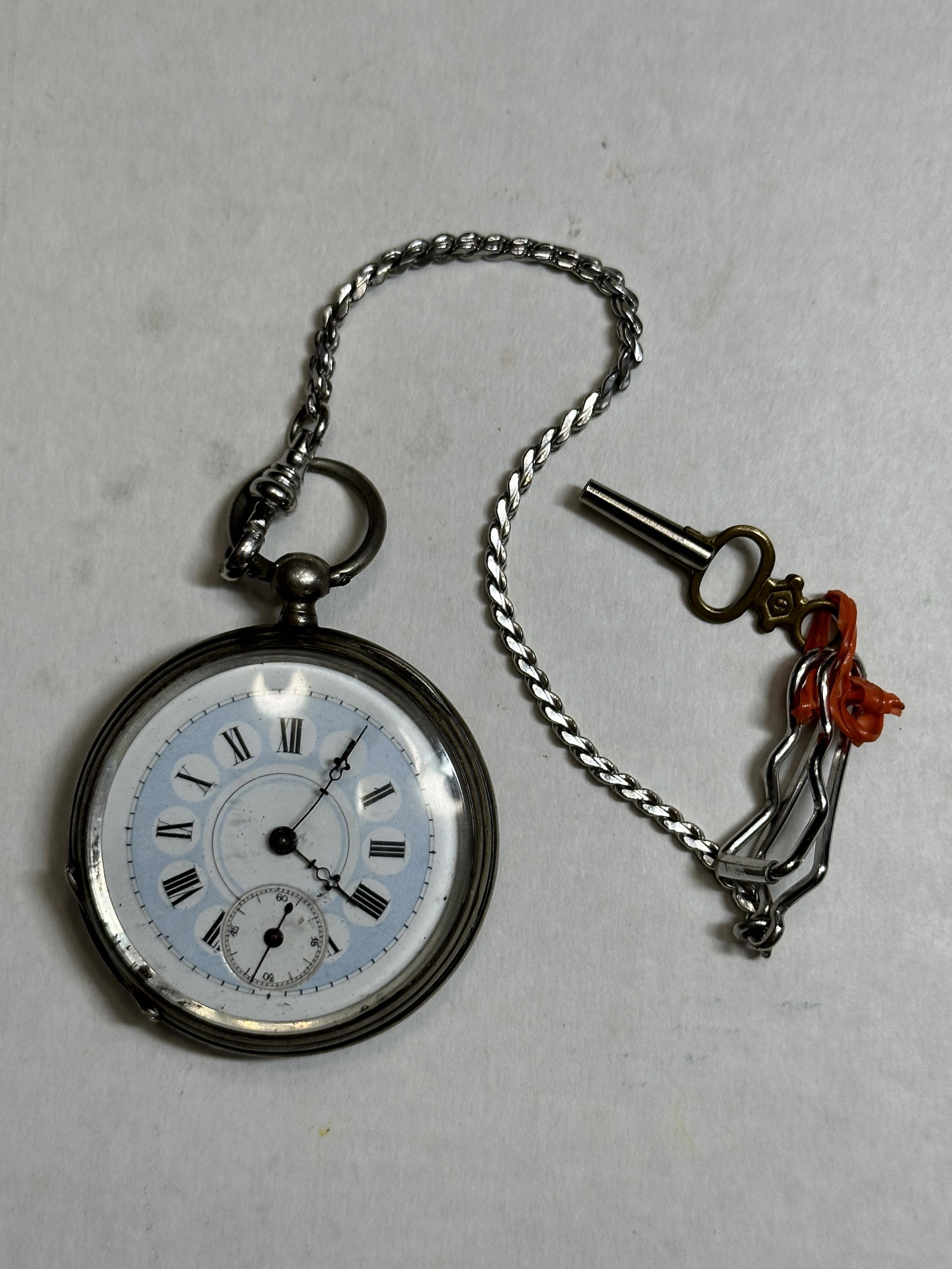 ANTIQUE ENAMELED FACE MENS POCKET WATCH WITH CHAIN: ANTIQUE ENAMELED FACE MENS POCKET WATCH WITH CHAIN. HAND-WINDING WITH KEY MOVEMENT. WE ARE NOT SURE IF IT WORKS OR NOT. PLEASE VIEW ALL DETAILED PICTURES.