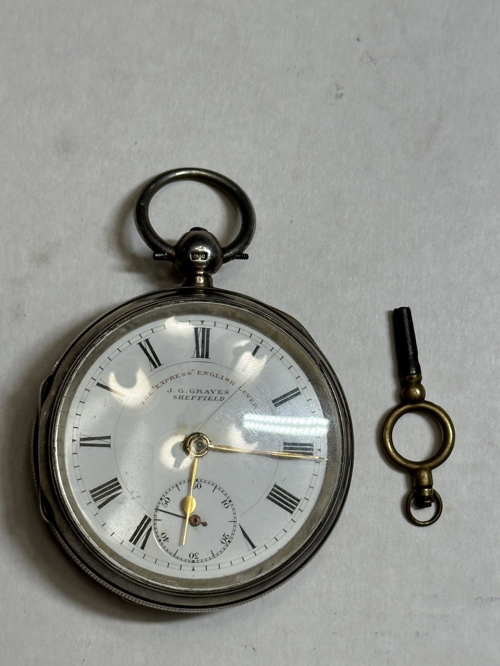 ANTIQUE J.G. GRAVES SHEFFIELD SILVER POCKET WATCH KEY-WIND: ANTIQUE J.G. GRAVES SHEFFIELD SILVER POCKET WATCH KEY-WIND. A RARE FIND. WE ARE NOT SURE IF THE WATCH RUNS OR NOT. FOUND IN A RECENT ESTATE ESTATE SETTLEMENT AND IT WAS STORED AWAY. PLEASE VIEW ALL DE