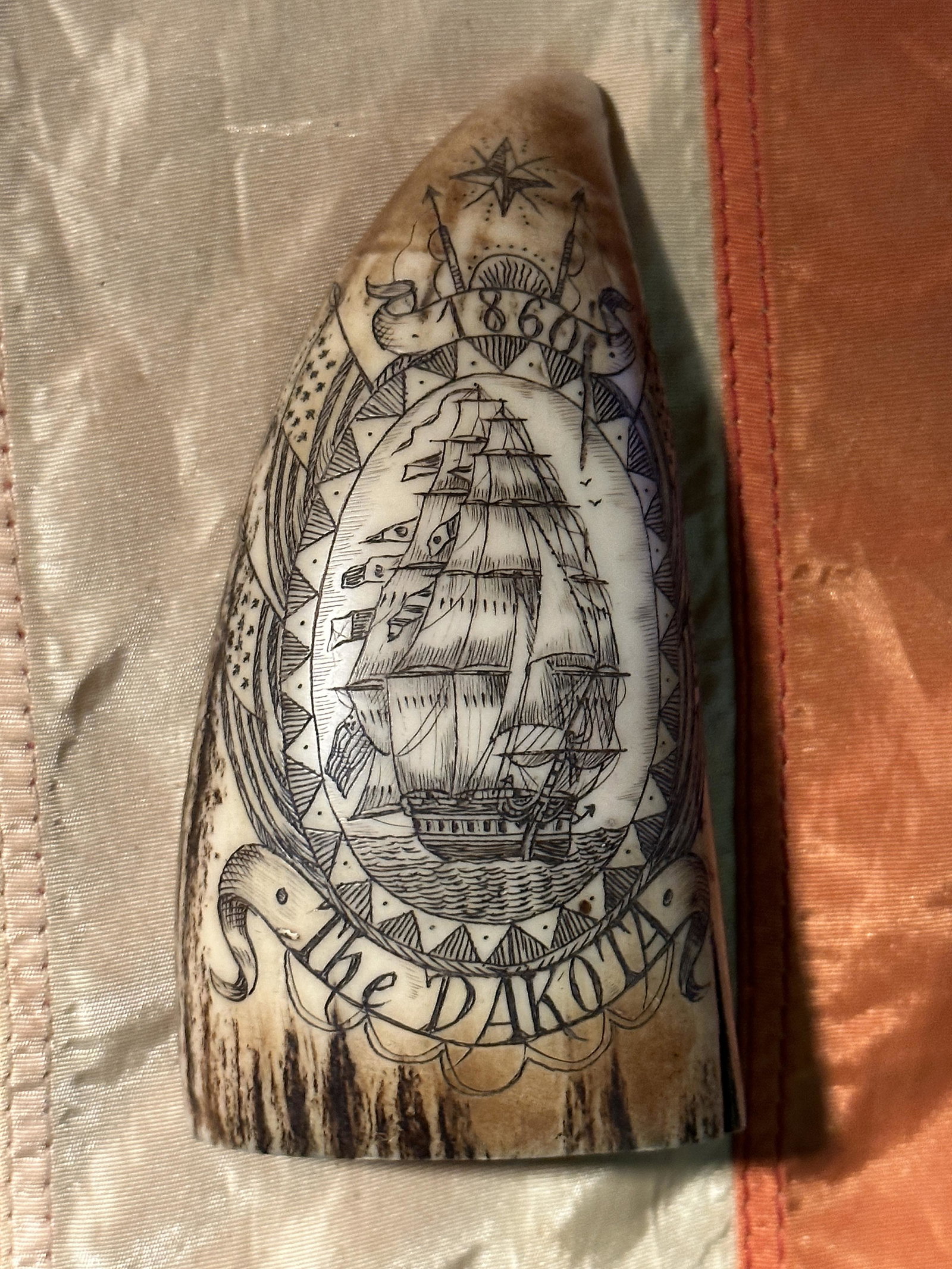CIVIL WAR DATED 1860 SCRIMSHAW BONE "THE DAKOTA": CIVIL WAR DATED 1860 SCRIMSHAW BONE "THE DAKOTA". DATED AND DEPICTING THE CIVIL WAR SHIP "THE DAKOTA". VERY WELL MADE WITH DETAILED CRAFTSMANSHIP. SHOWS GOOD WEAR AND USE. PLEASE VIEW ALL DETAILED PIC