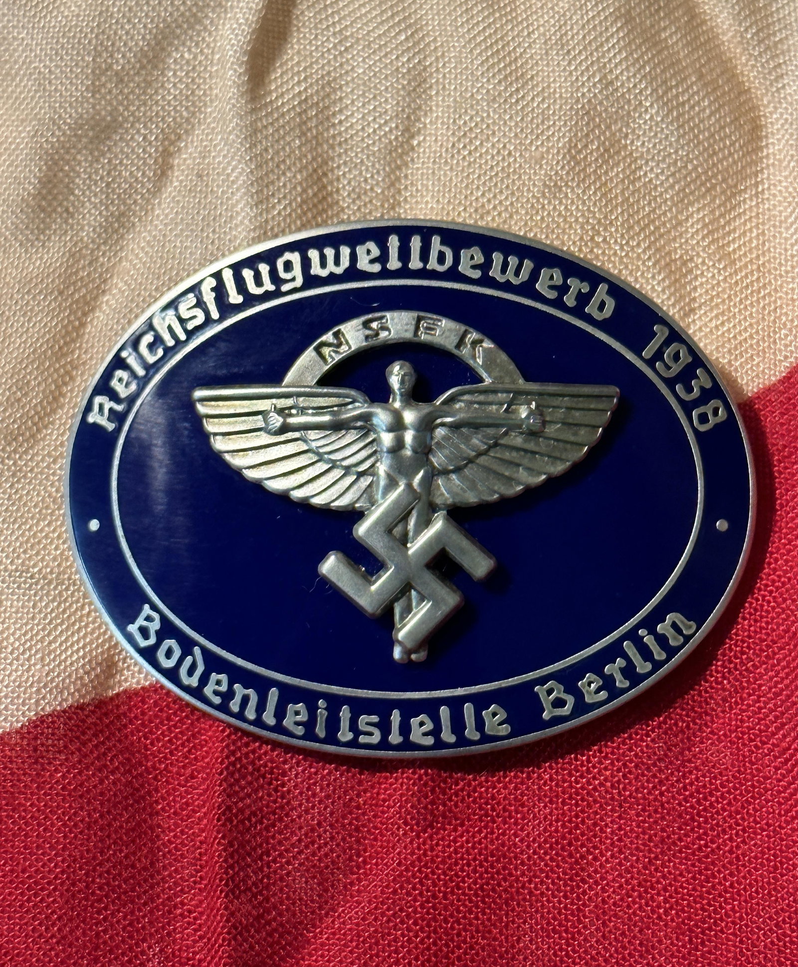 WW2 GERMAN NSFK DEUTSCHLANDFLUG 1938 BADGE BY ROB. NEFF BERLIN W57: WW2 GERMAN NSFK DEUTSCHLANDFLUG 1938 BADGE BY ROB. NEFF BERLIN W57. A RARE FIND. IT IS IN MINT OVERALL SHAPE AND CONDITION WITH A BEAUTIFUL OVERALL PATINA. SHOWS GOOD WEAR AND USE. A WELL MADE ANTIQUE