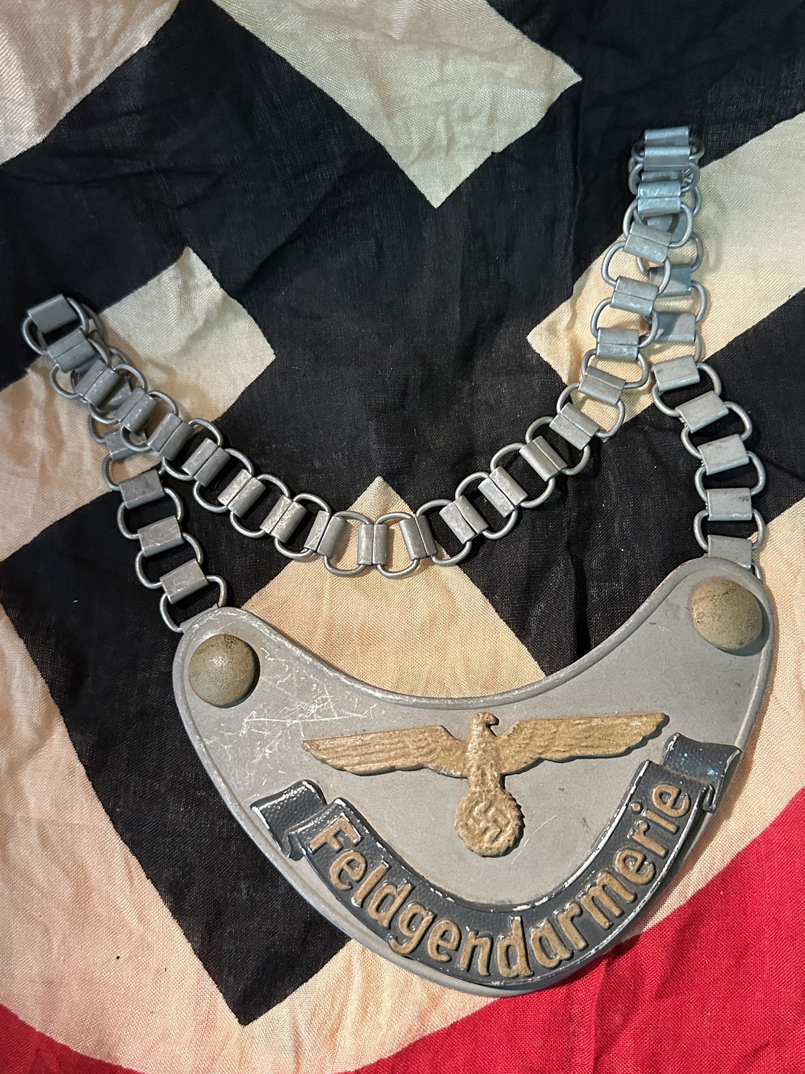 RARE WW2 GERMAN 3RD REICH FELDGENDARMERIE GORGET: RARE WW2 GERMAN 3RD REICH FELDGENDARMERIE GORGET. A RARE FIND. IT IS IN MINT OVERALL SHAPE AND CONDITION WITH A BEAUTIFUL OVERALL PATINA. SHOWS GOOD WEAR AND USE. PLEASE VIEW ALL DETAILED PICTURES. A