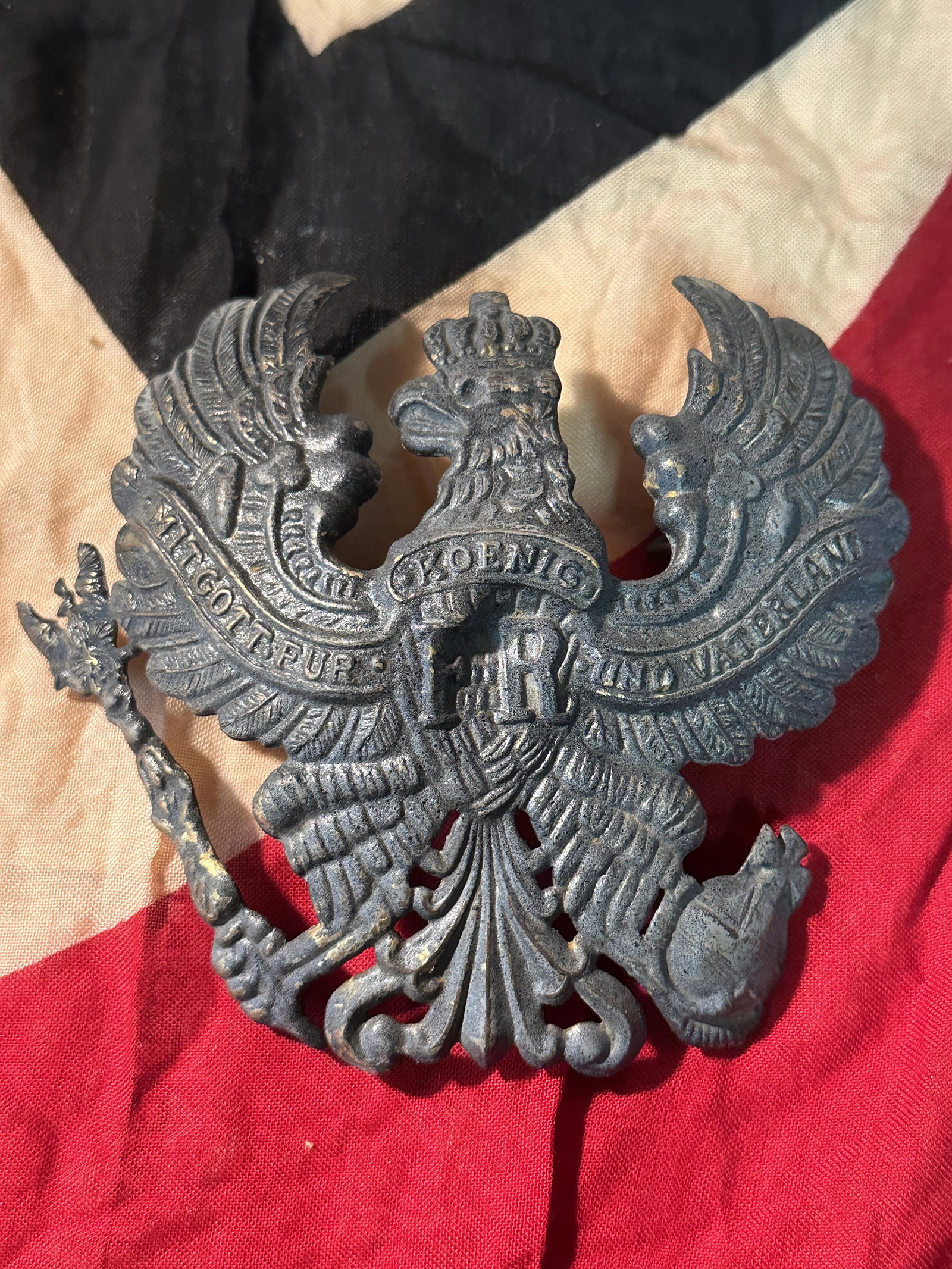 German WW1 Jaeger Shako Helmet Plate: German WW1 Jaeger Shako Helmet Plate. A much smaller plate compared with the standard spike helmet plate. This one is 3 1/8” wide x 3 5/8” tall. Stamped sheet steel with a field gray paint