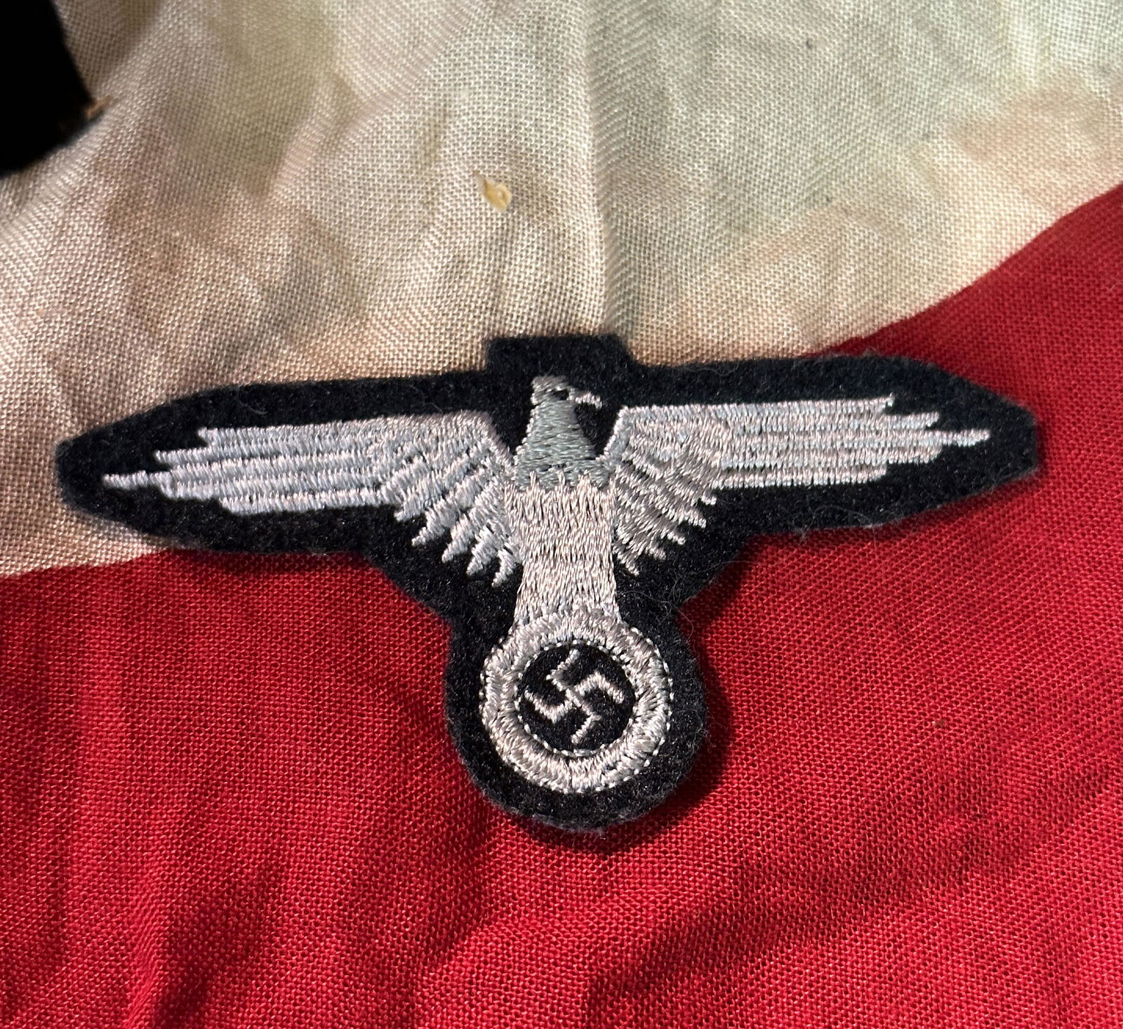 WW2 GERMAN WAFFEN SS OFFICERâ€™S UNIFORM EAGLE: Rare WW2 German Waffen SS enlisted manâ€™s arm sleeve eagle. Eagle is the semi padded variety with cotton thread & thatched fabric base. Light age overall. This is a typical 1944-45 made and worn