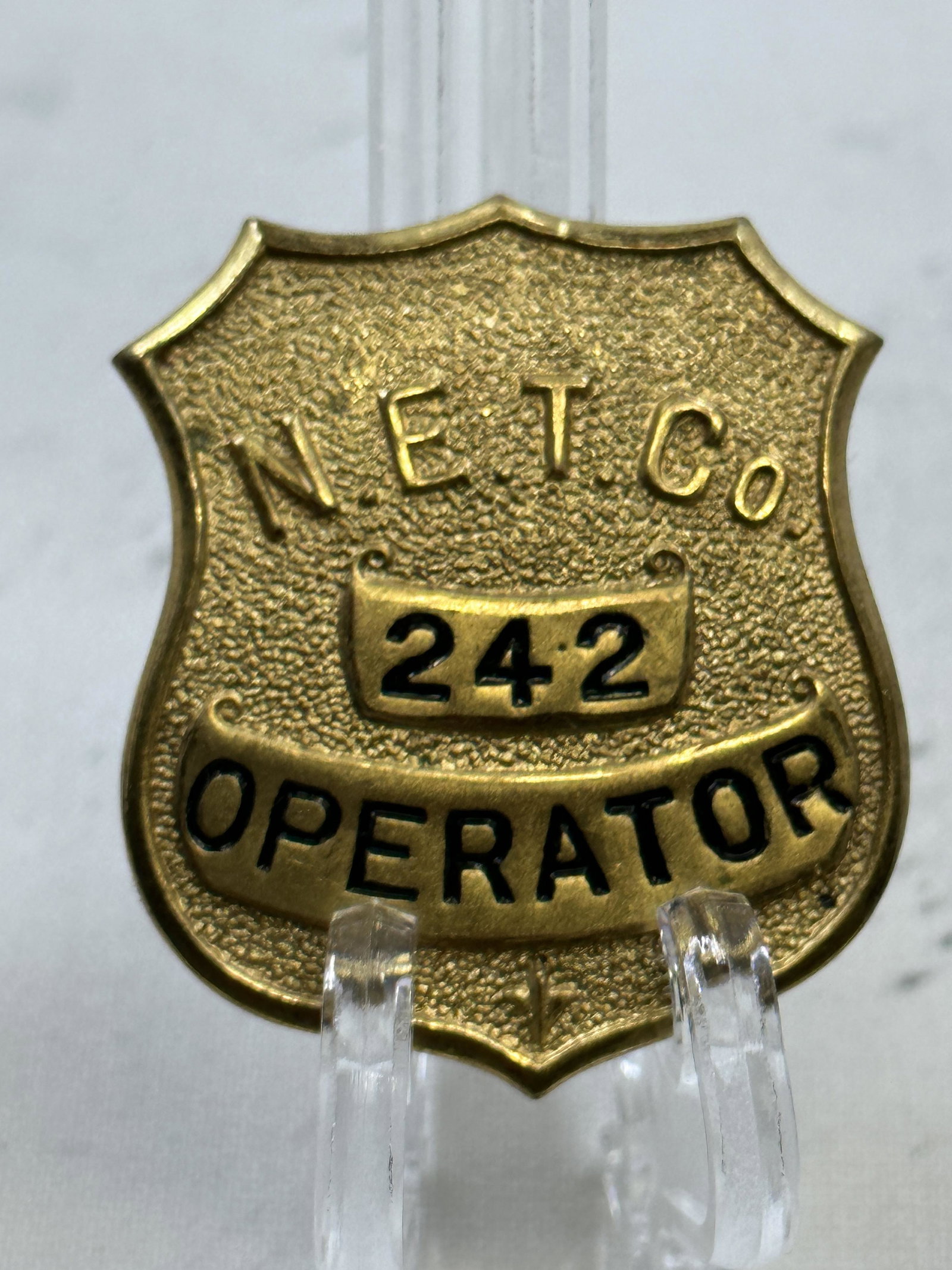 VINTAGE NET CO. OPERATOR #242 BADGE (1 of 4)