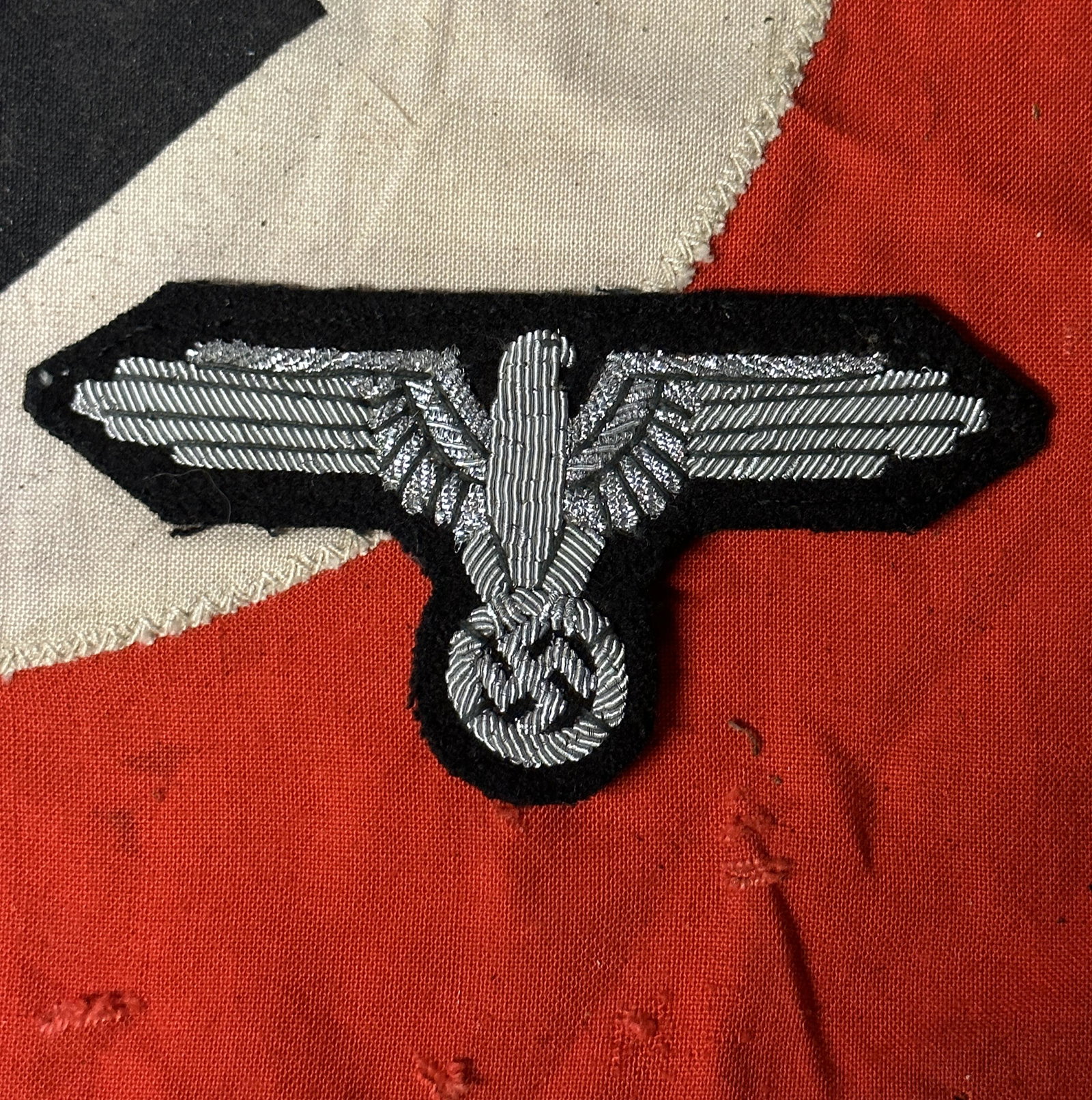 WW2 GERMAN WAFFEN SS OFFICERâ€™S UNIFORM EAGLE WITH RZM PAPER TAG: WW2 GERMAN WAFFEN SS OFFICERâ€™S UNIFORM EAGLE WITH RZM PAPER TAG. Rare WW2 German Waffen SS enlisted manâ€™s arm sleeve eagle. Eagle is the semi padded variety with cotton thread & thatched