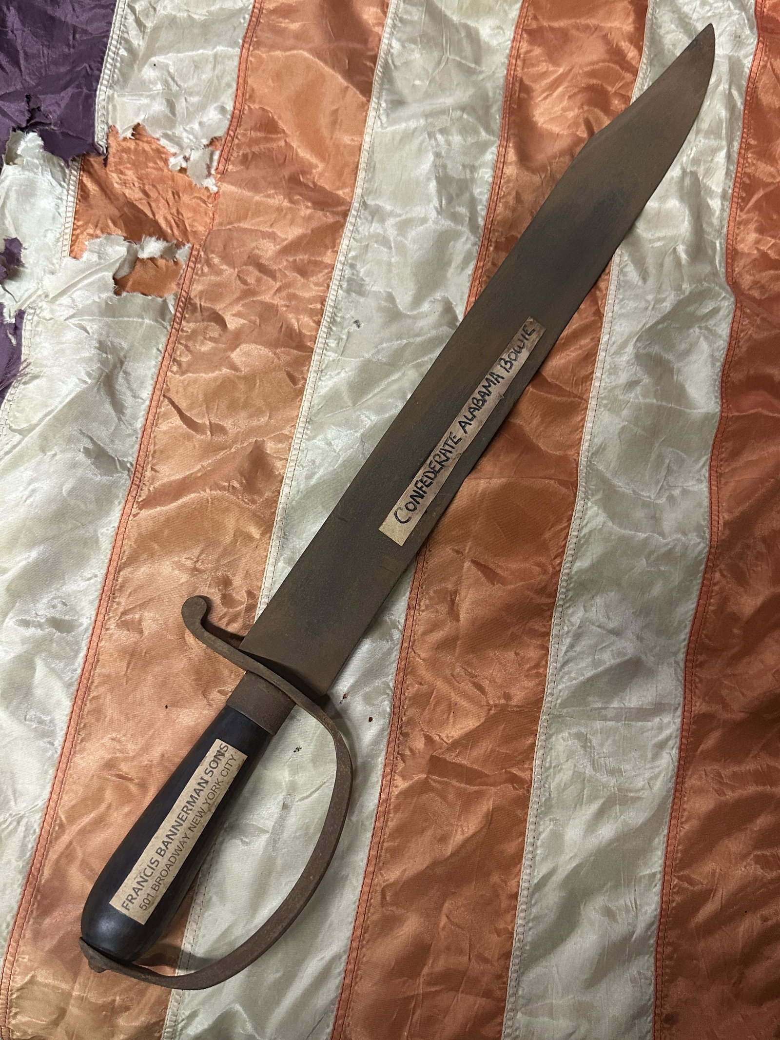 RARE CIVIL WAR CONFEDERATE ALABAMA D-GUARD BOWIE KNIFE BY BANNERMAN'S: RARE CIVIL WAR CONFEDERATE ALABAMA D-GUARD BOWIE KNIFE BY FRANCIS BANNERMAN. AN ULTRA RARE FIND WITH THE ORIGINAL MAKER TAG STILL ATTACHED. SHOWS GOOD WEAR AND USE. VERY WELL BUILT BOWIE KNIFE. PLEASE
