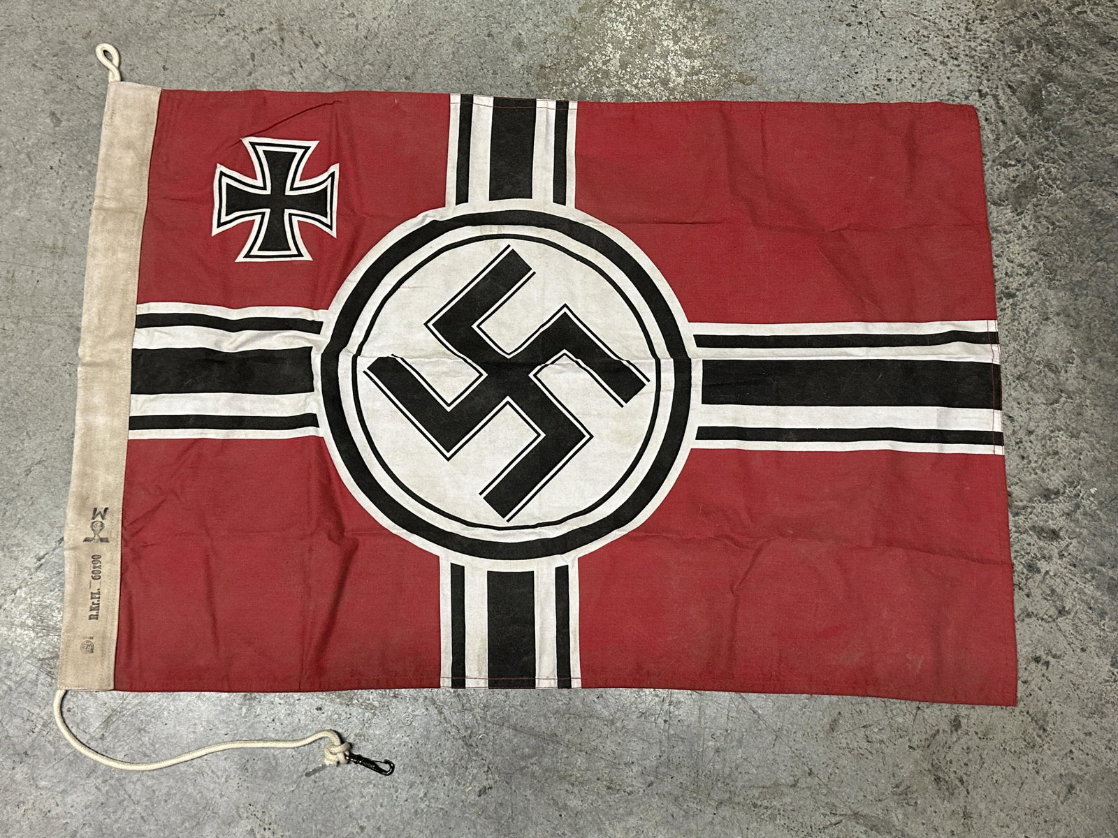 RARE WW2 GERMAN KRIEGSMARINE FLAG BY RZM - MAKER MARKED: RARE WW2 GERMAN KRIEGSMARINE FLAG BY RZM - MAKER MARKED. A VERY RARE FIND. FLAG PRESENTS ROPE HOIST WITH POLE EDGE. SHOWS GOOD WEAR AND USE WITH A BEAUTIFUL PATINA THROUGHOUT. PLEASE VIEW ALL DETAILED