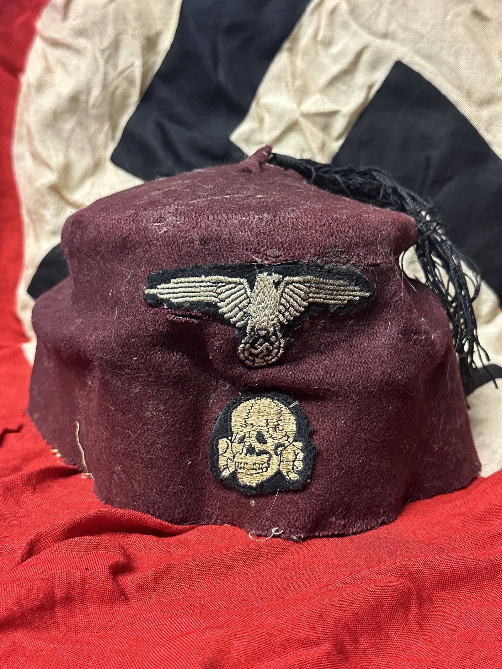 German WWII Waffen SS M43 Maroon Parade Fez for Foreign Volunteers: German WWII Waffen SS M43 Maroon Parade Fez for Foreign Volunteers. his is a maroon fez that was part of the dress uniform of a Waffen-SS military detachment composed of Muslims from Bosnia, Croatia, 