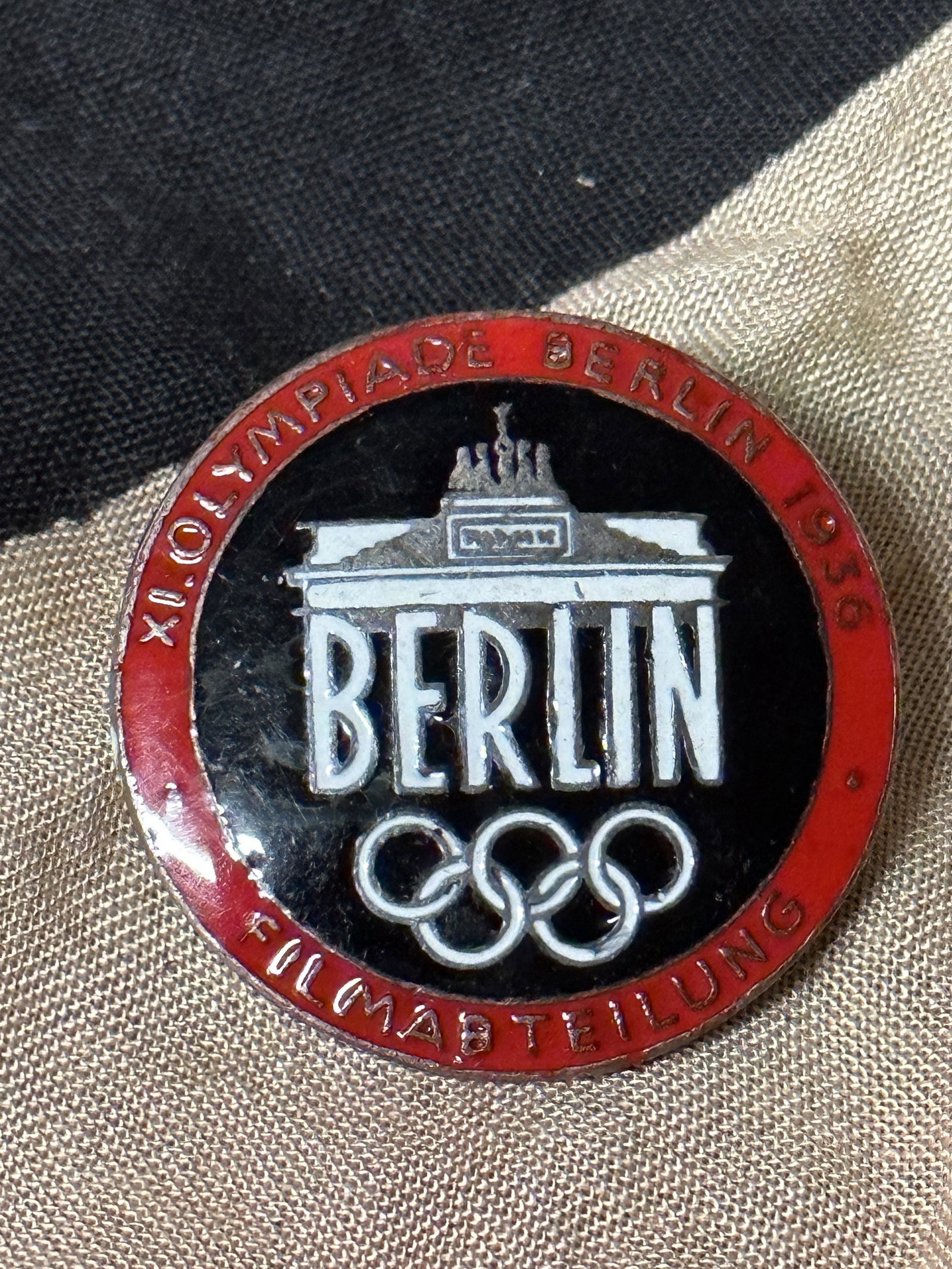 WW2 German 40th Olympics, Film Makers Badge Berlin Enameled, 1936.: WW2 German 40th Olympics, Film Makers Badge Berlin Enameled, 1936. On August 1, 1936, Hitler opened the XLTH Olympiad. Musical fanfares directed by the famous composer Richard Strauss announced the di