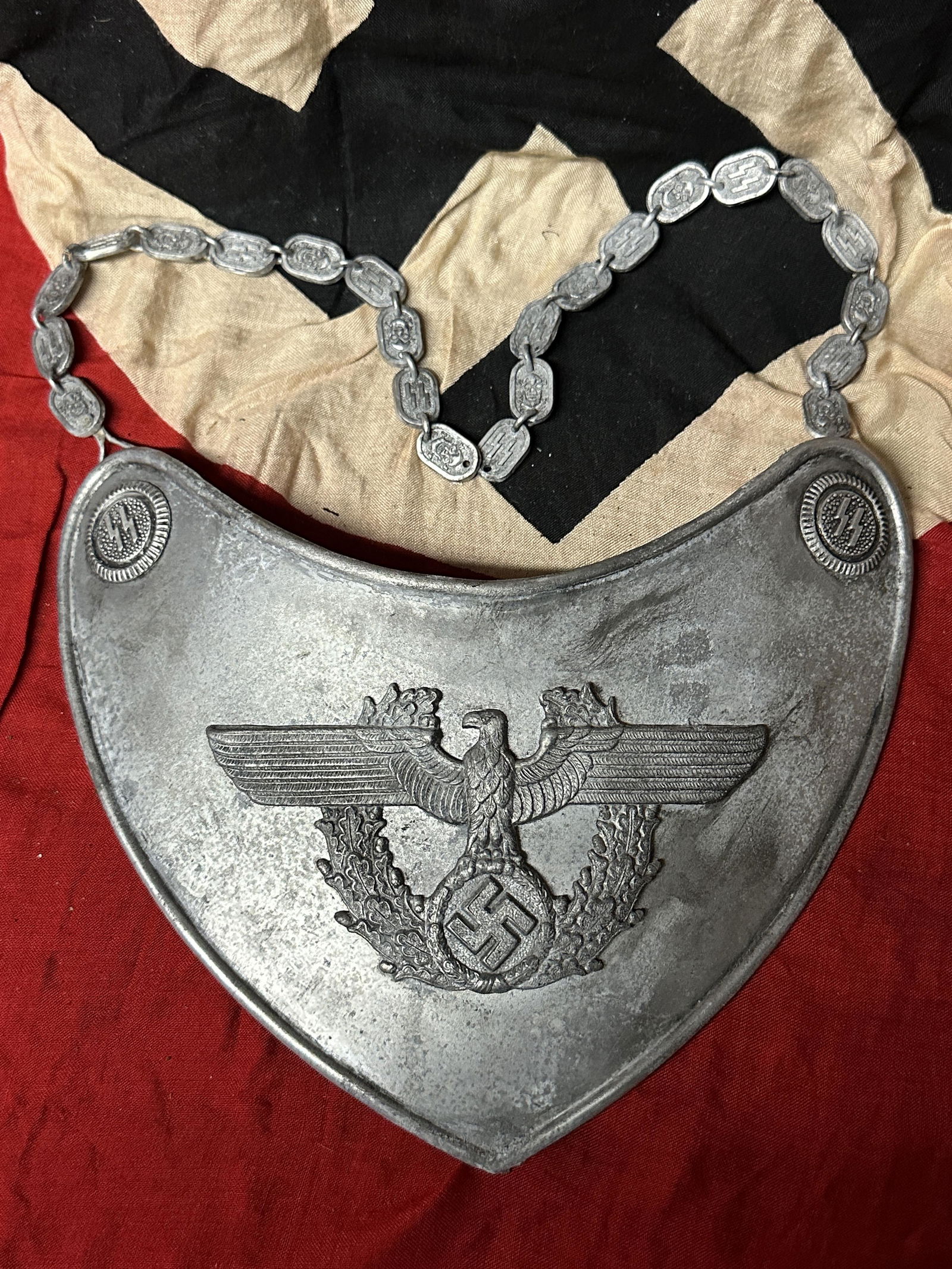 ULTRA RARE WW2 GERMAN HIGH RANK SS POLICE GORGET BREASTPLATE W/RZM SS TAG: ULTRA RARE WW2 GERMAN HIGH RANK SS POLICE GORGET BREASTPLATE W/RZM SS TAG. A VERY RARE FIND. IT IS IN MINT OVERALL SHAPE AND CONDITION WITH A BEAUTIFUL OVERALL PATINA. SHOWS GOOD WEAR AND USE. HAS THE