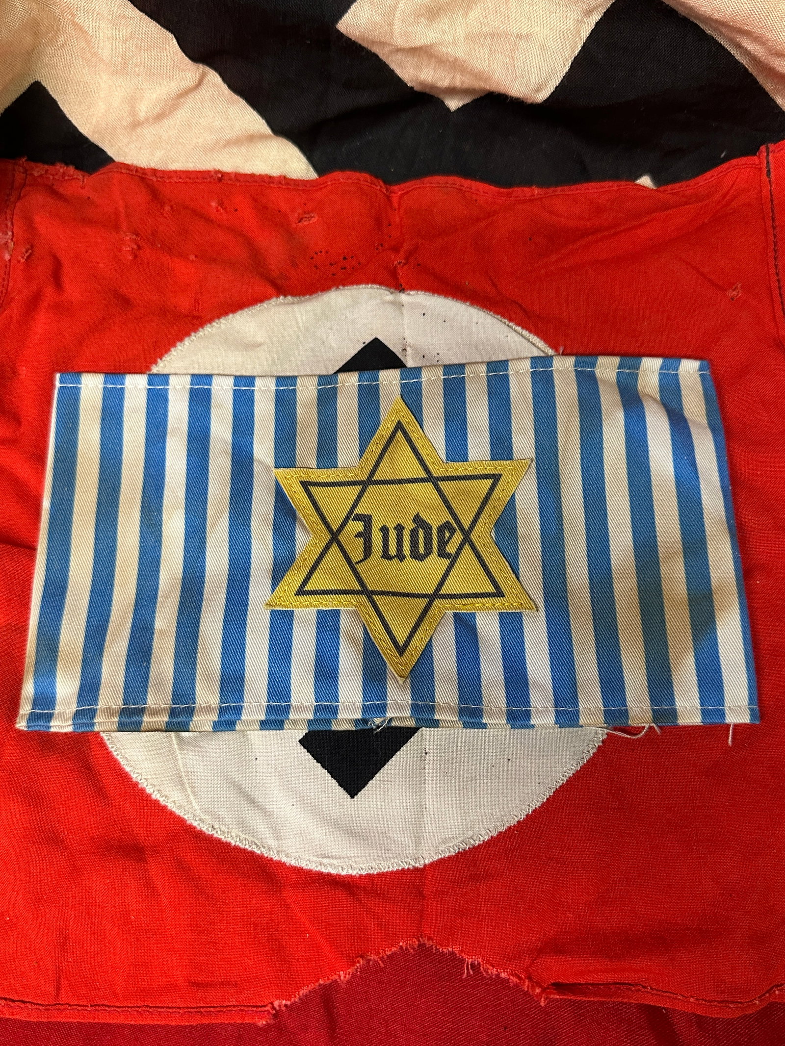 WW2 GERMAN CONCENTRATION CAMP JUDE STAR OF DAVID JEWISH ARMBAND: WW2 GERMAN CONCENTRATION CAMP JUDE STAR OF DAVID JEWISH ARMBAND. A RARE FIND. IT IS IN MINT OVERALL SHAPE AND CONDITION WITH A BEAUTIFUL OVERALL PATINA. SHOWS GOOD WEAR AND USE. PLEASE VIEW ALL DETAIL