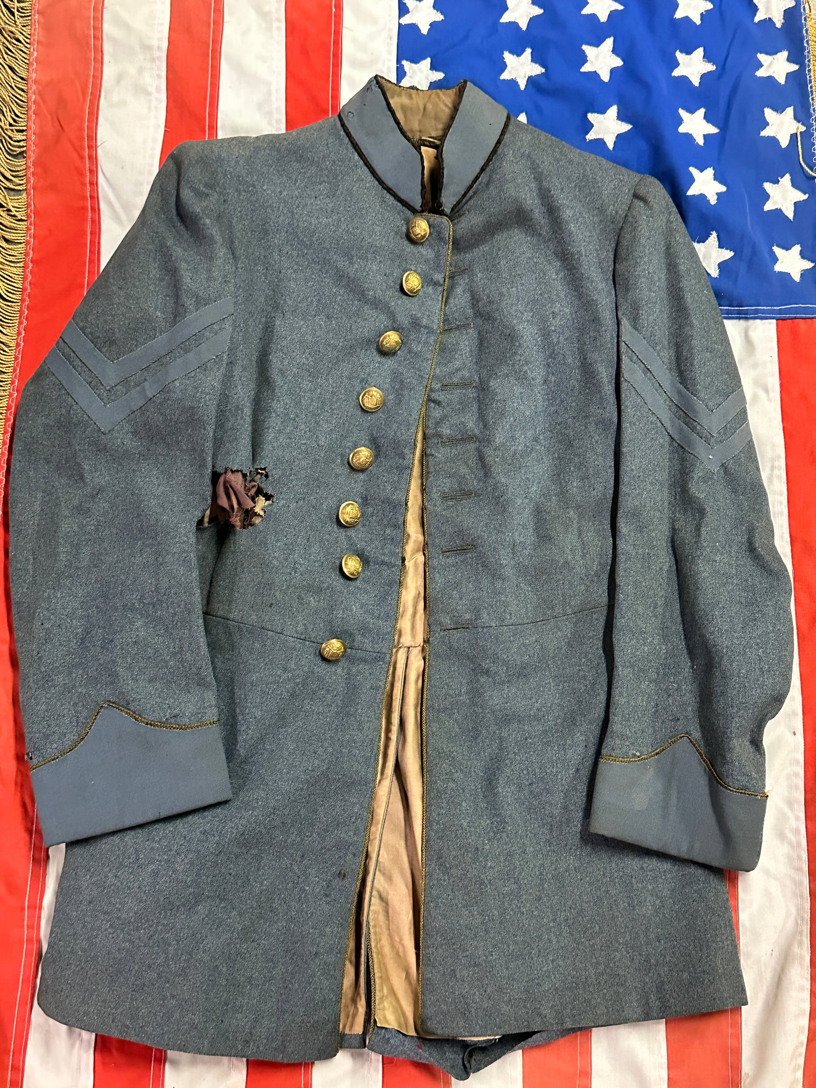 ULTRA RARE CIVIL WAR MARYLAND OFFICER FROCK COAT JACKET: ULTRA RARE CIVIL WAR MARYLAND OFFICER FROCK COAT JACKET. A VERY RARE FIND WITH ALL MATCHING MARYLAND STATE BUTTONS. HAS A GREAT LOOK TO IT WITH AN EXCELLENT OVERALL EYE APPEAL. SHOWS GOOD WEAR AND BAT