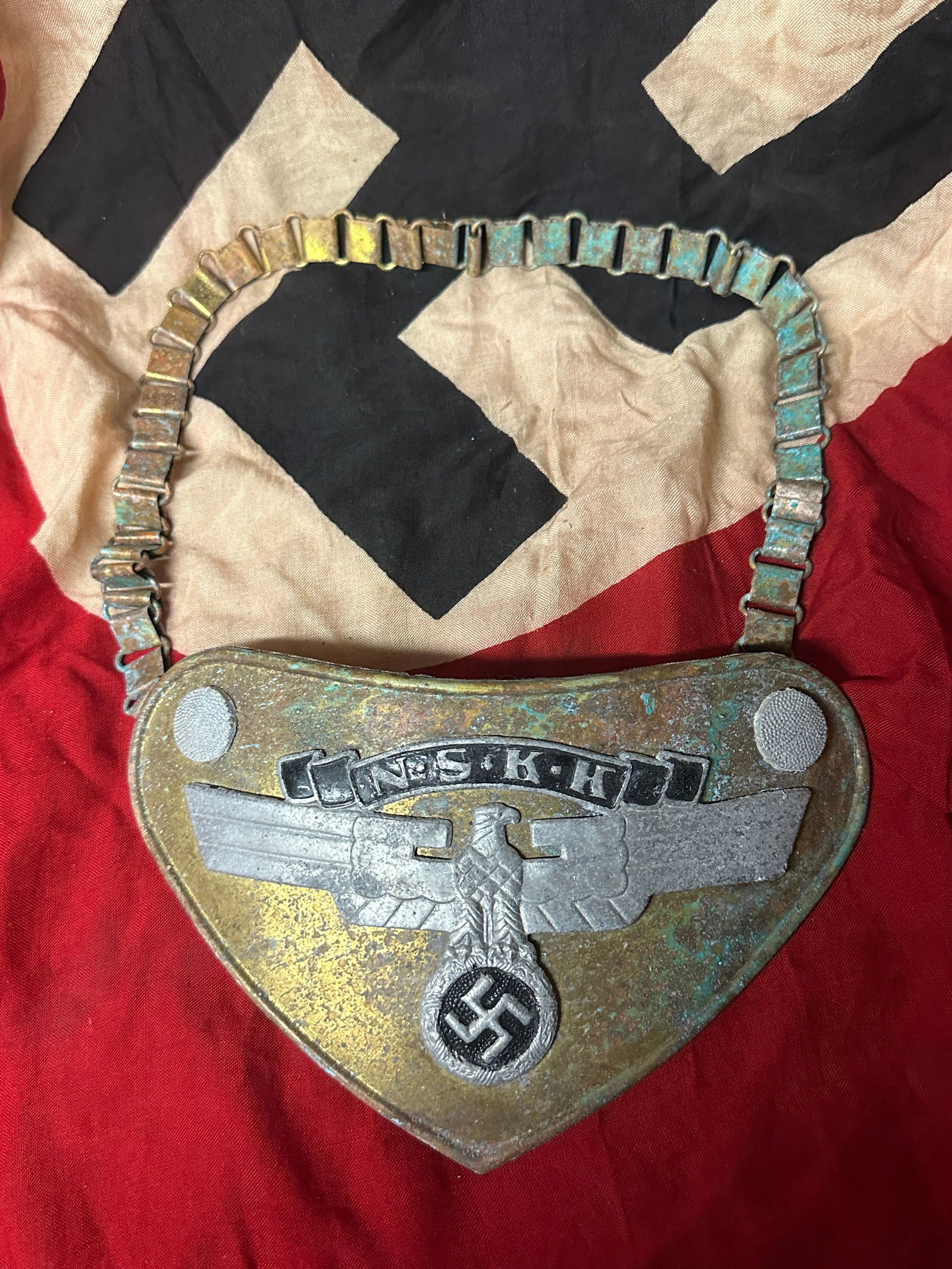 RARE WW2 GERMAN NSKK OFFICER GORGET WITH CHAIN & RZM PAPER TAG: RARE WW2 GERMAN NSKK OFFICER GORGET WITH CHAIN & RZM PAPER TAG. A RARE FIND. RETAINS MOST OF ITS ORIGINAL SHAPE AND CONDITION. SHOWS GOOD WEAR AND USE WITH A BEAUTIFUL PATINA THROUGHOUT. PLEASE VIEW A