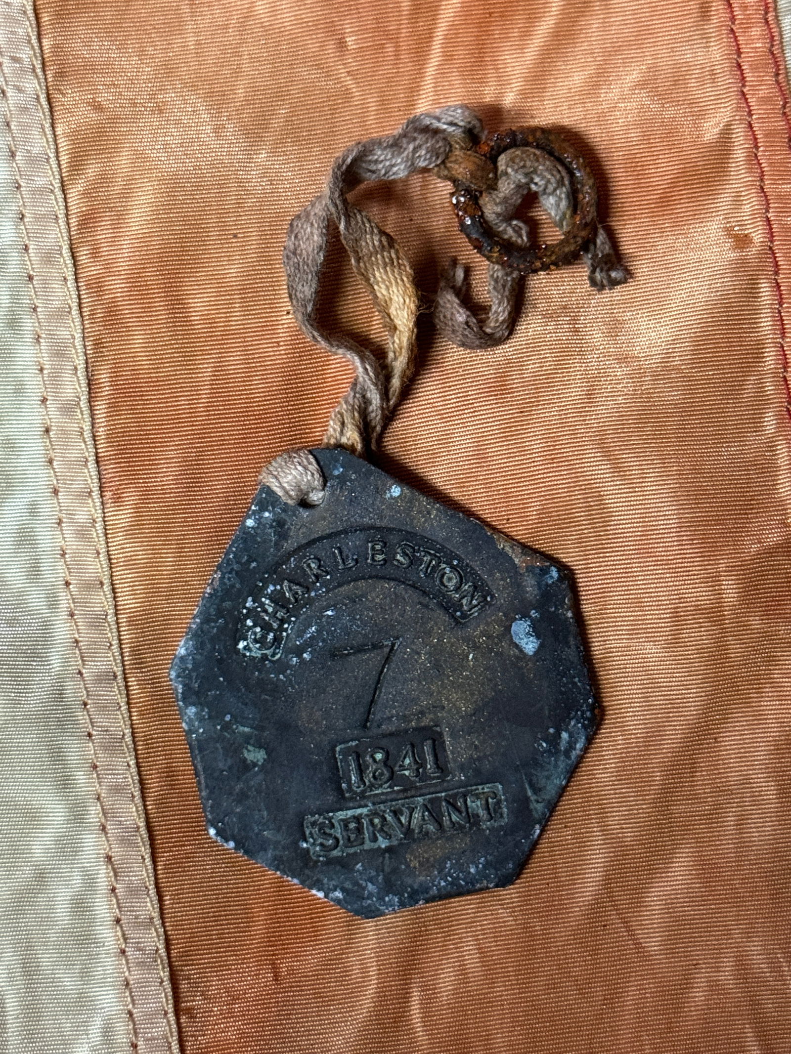 SCARCE 1841 PORTER CHARLESTON S.C. #7 SLAVE SERVANT TAG: SCARCE 1841 PORTER CHARLESTON S.C. #7 SLAVE SERVANT TAG. A RARE FIND. IT IS IN MINT OVERALL SHAPE AND CONDITION WITH A BEAUTIFUL PATINA THROUGHOUT. HAS A DUG LIKE PATINA THROUGHOUT. SHOWS GOOD WEAR AN