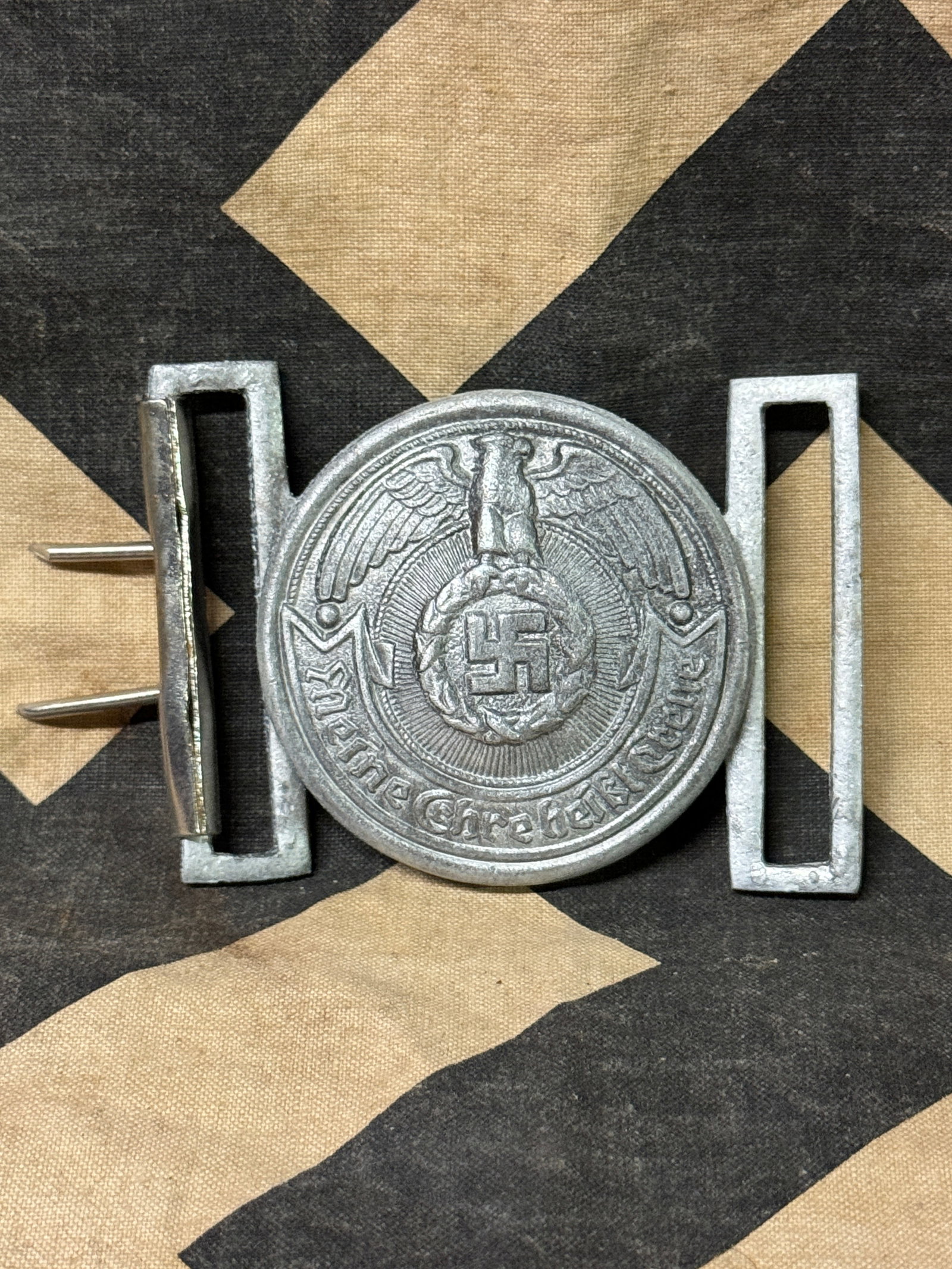 WW2 GERMAN SS Officerâ€™s Belt Buckle by â€œRZM SS": WW2 GERMAN SS Officerâ€™s Belt Buckle by â€œRZM SS". A RARE FIND. Good condition aluminum-based SS Officerâ€™s Belt Buckle by â€œRZM SS". Sturdy construction with detailed craftsmans