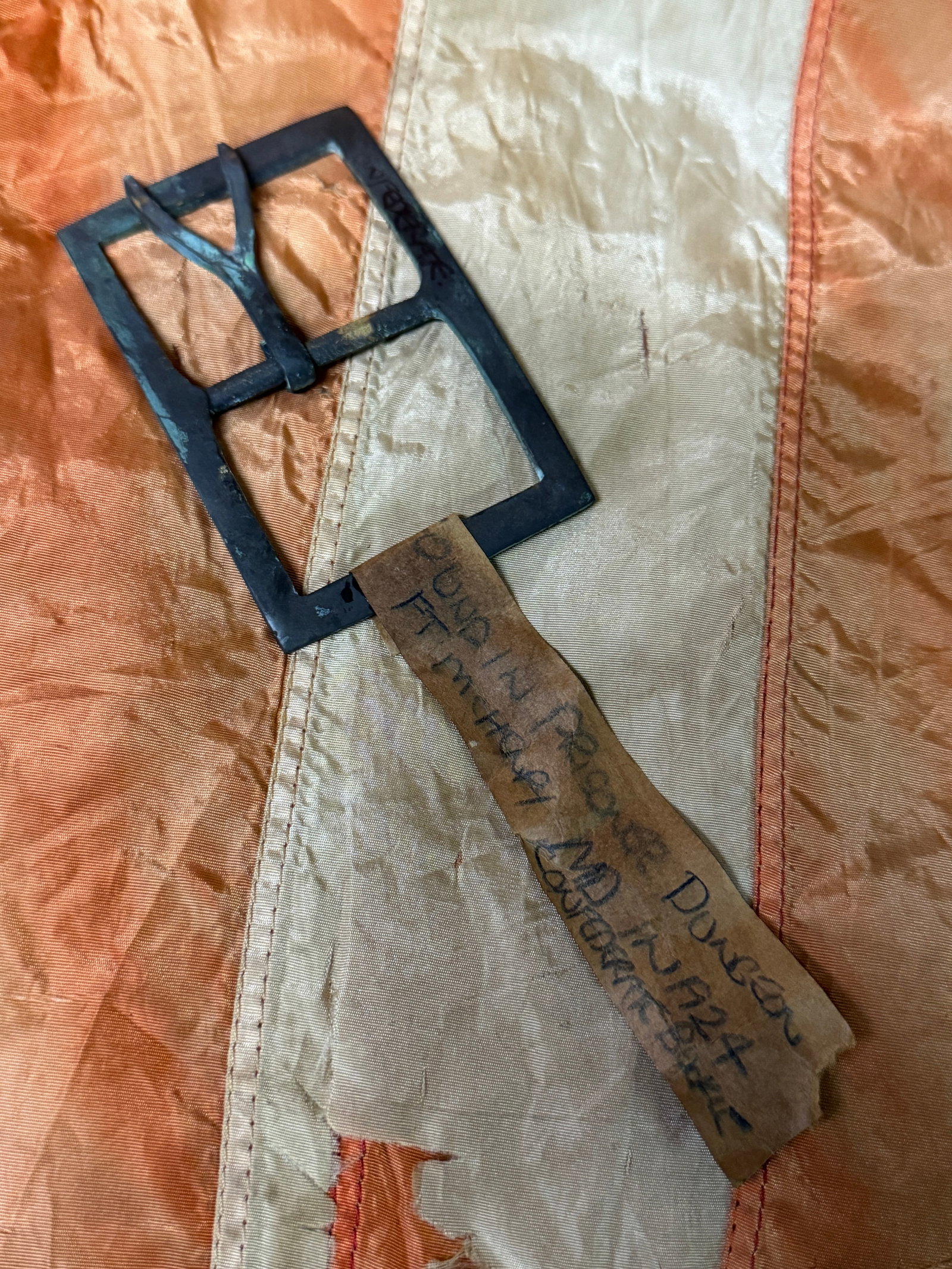 CSA CIVIL WAR CONFEDERATE FORKED TONGUE BELT BUCKLE WITH PROVENANCE TAG: CSA CIVIL WAR CONFEDERATE FORKED TONGUE BELT BUCKLE WITH PROVENANCE TAG. A RARE FIND. THE TAG READS "WAS FOUND IN PRISONER DUNGEON IN FT. MCHENRY, MD IN 1924". SHOWS GOOD WEAR AND USE WITH A BEAUTIFUL